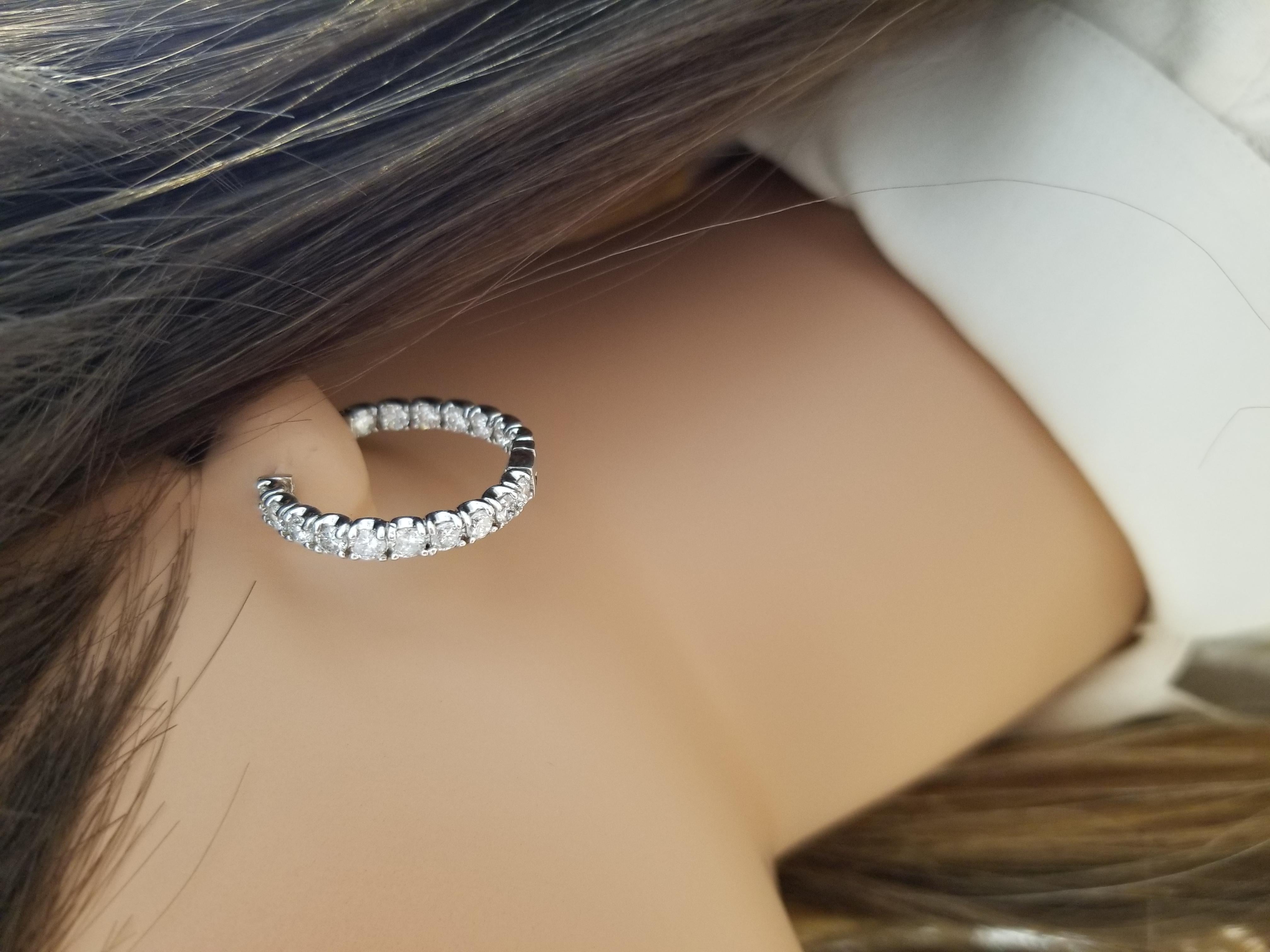 This is a lovely pair of inside & outside hoops, set with 34 stunning diamonds that total up to 2.90 carats. Precision set in 14k white gold earrings, these diamond hoops take it to the next level.