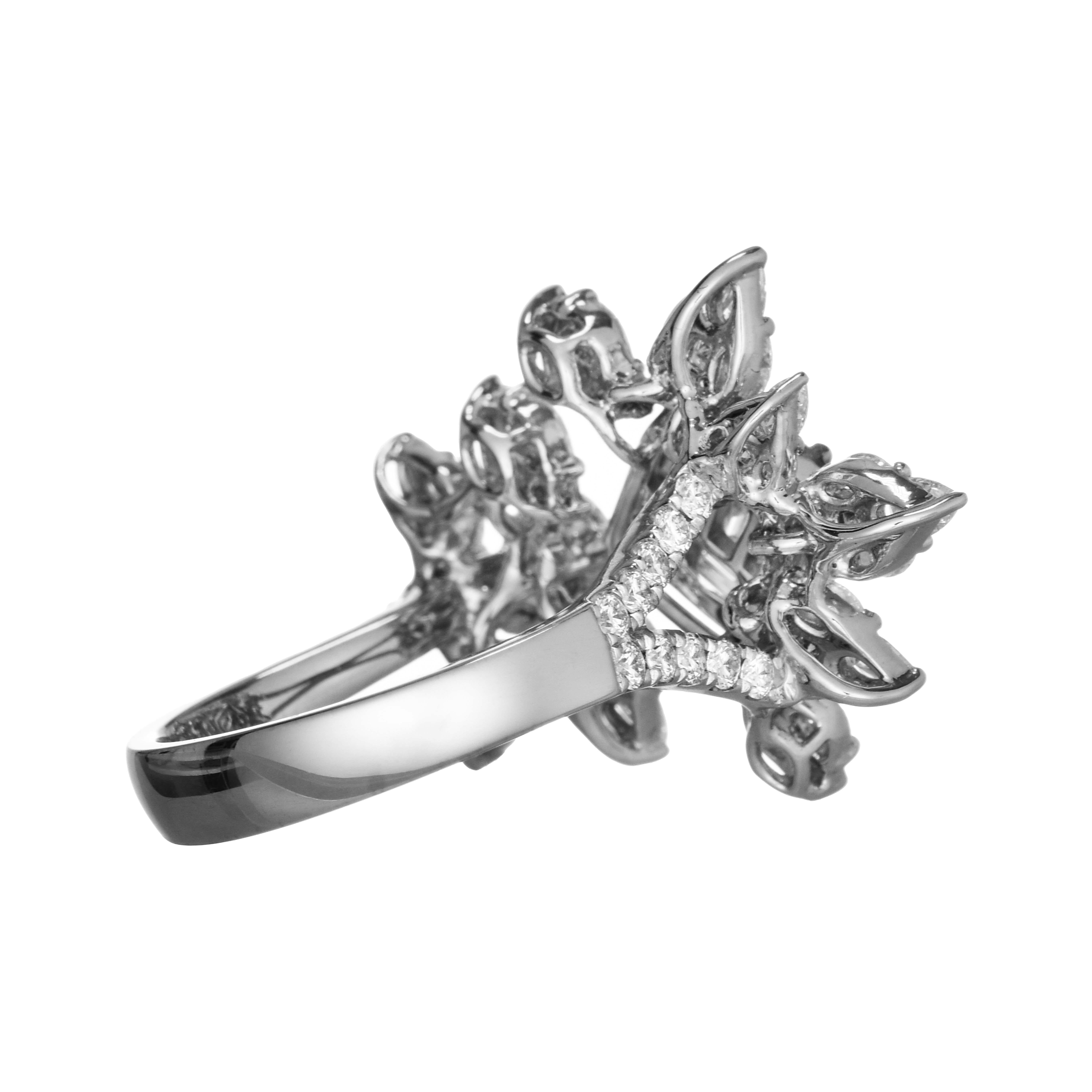 This beautiful ring, inspired by nature, features a floral design made of variously cut white diamonds, set in a white gold band embellished with round white diamonds.

18 Round White Diamonds: 0.61 Carat
66 Fancy White Diamonds: 2.30 Carats
(Total