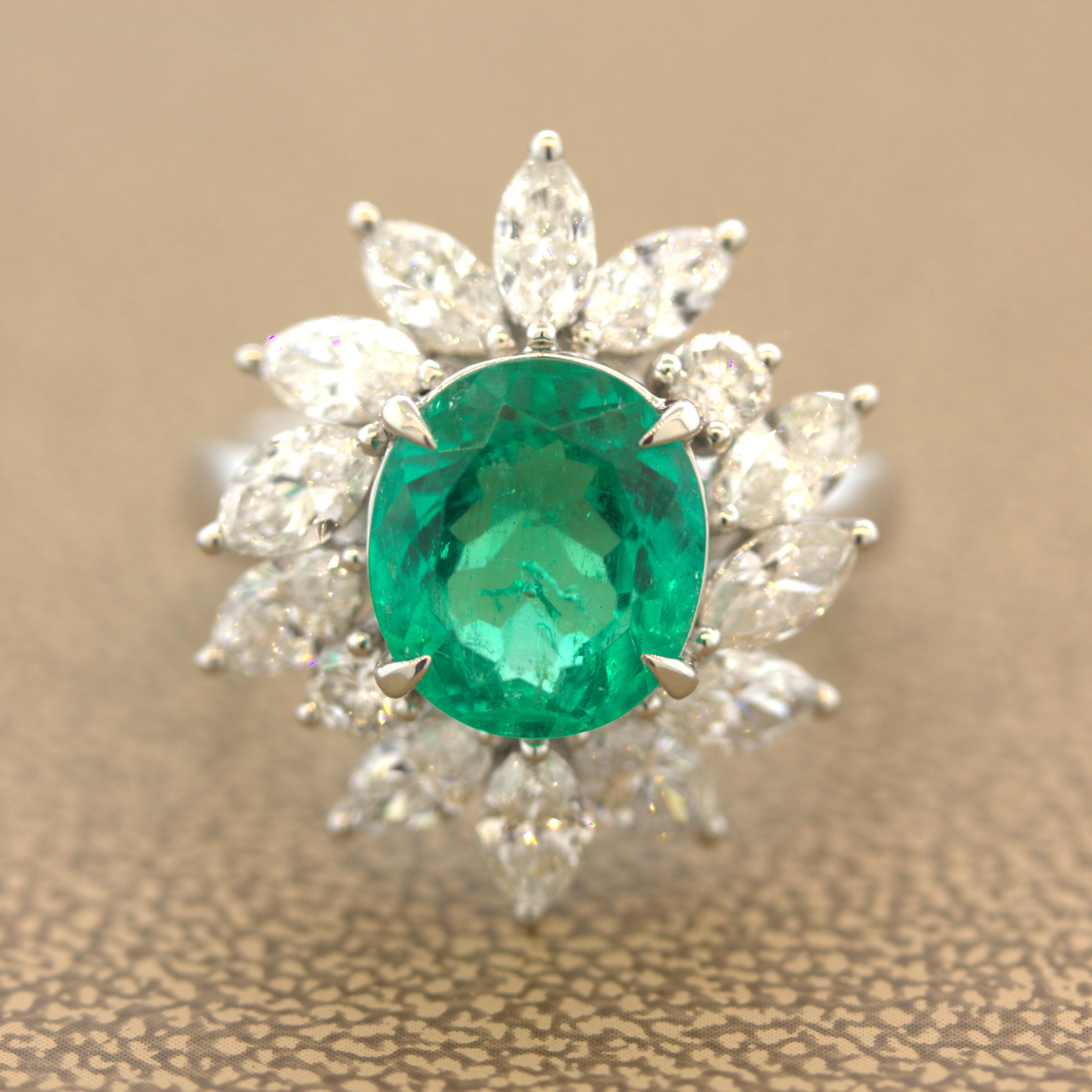 A fine and sweet emerald weighing 2.91 carats takes center stage of this classic platinum ring. The emerald has a lovely oval shape along with a bright rich pure green color that is so pleasing to the eye. It is complemented by a halo of large