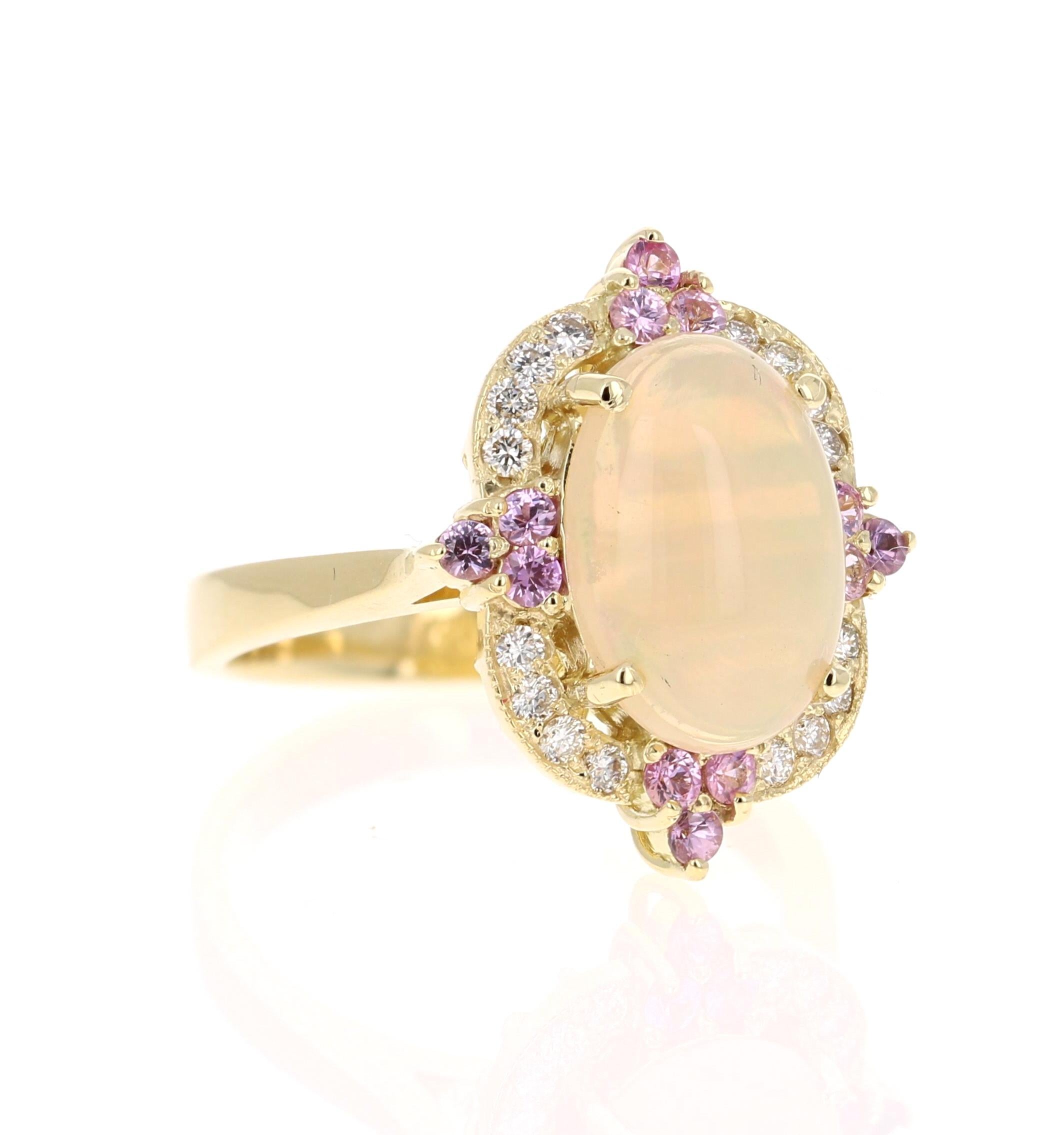 2.91 Carat Oval Cut Opal Diamond 18 Karat Yellow Gold Ring

The Oval Cut Opal in this ring weighs 2.30 Carats and the measurements of the Opal are 8 mm x 12 mm. The Opal is surrounded by 4 Pink Sapphires that weigh 0.37 carats and also 16 Round Cut