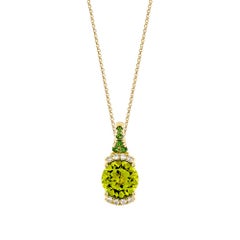 Peridoto Sunita Nahata 2.91ct. Ciondolo in 18KYG con tsavorite e diamante.