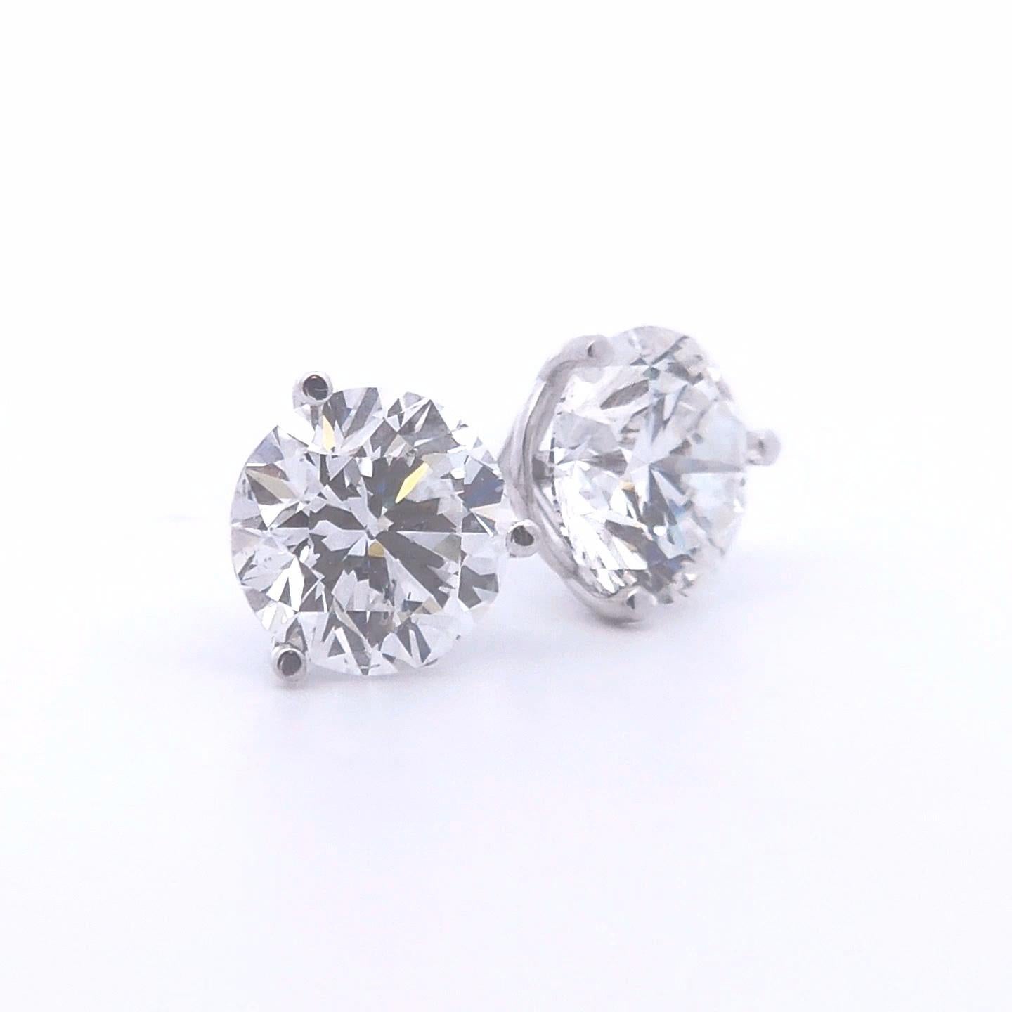 These stunning 2.91ct Round Diamond Stud Earrings in 14k White Gold are the perfect blend of elegance and timeless beauty. Crafted with precision, each earring features a brilliant round diamond that totals 2.91 carats, offering exceptional fire and