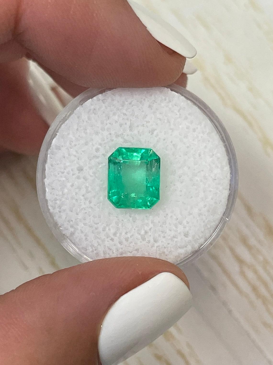 Stone: Emerald
Weight: 2.91-carats
Shape: Emerald Cut
Clarity: Transparent
Luster: Very Good
Color: Medium Yellowish Green
Measurements: 8.82mm x 7.55mm x 5.90mm
Geographic Origin: Colombia
Treatment: Natural, Oiling

Comments: Due to their growth