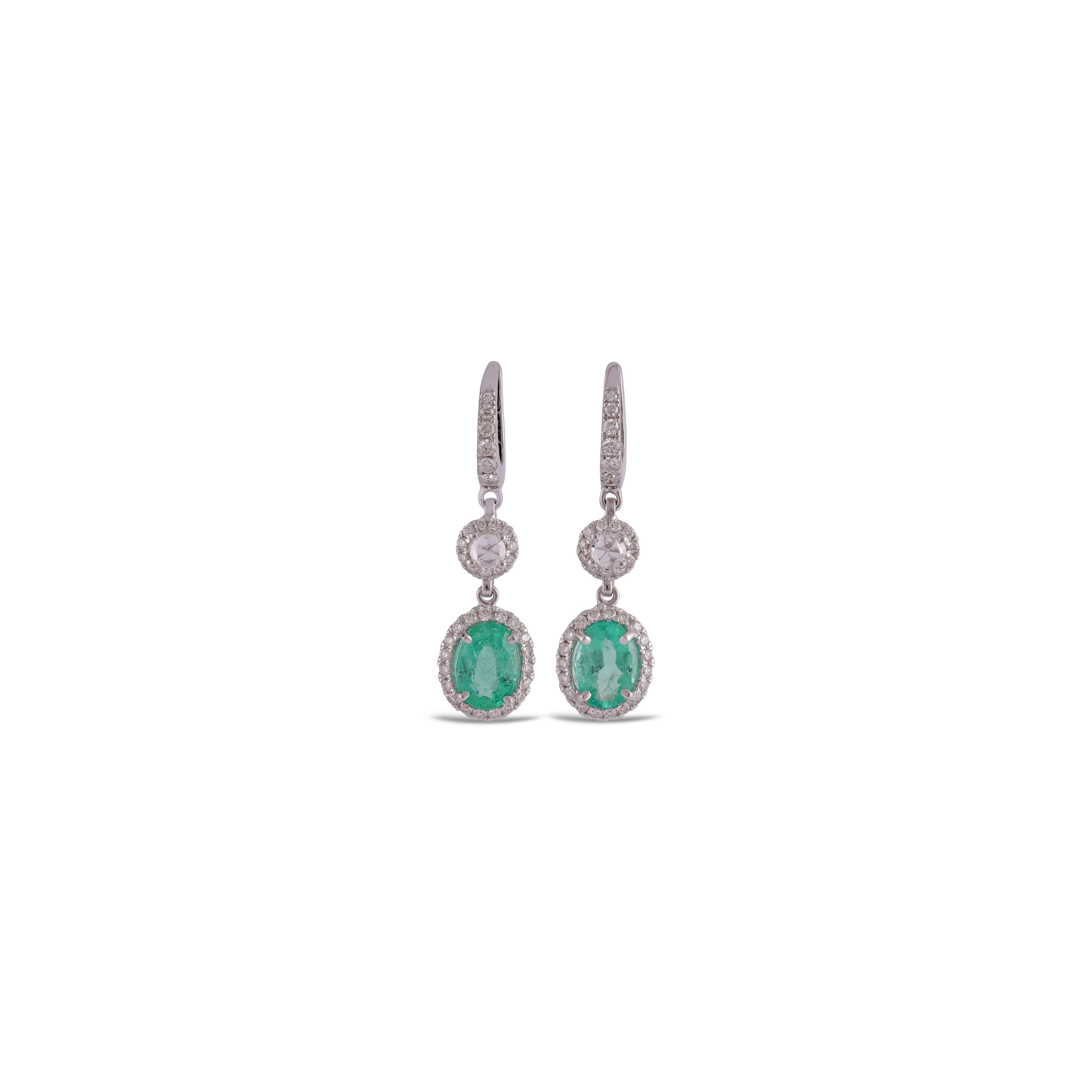 This is an elegant emerald & diamond Earring studded in 18k gold with 2 piece of  Zambian emerald weight 2.92 carat With diamonds weight 1.06 carat, this entire Earring studded in 18k gold


 its a classic wearable emerald-diamond Earring. 
