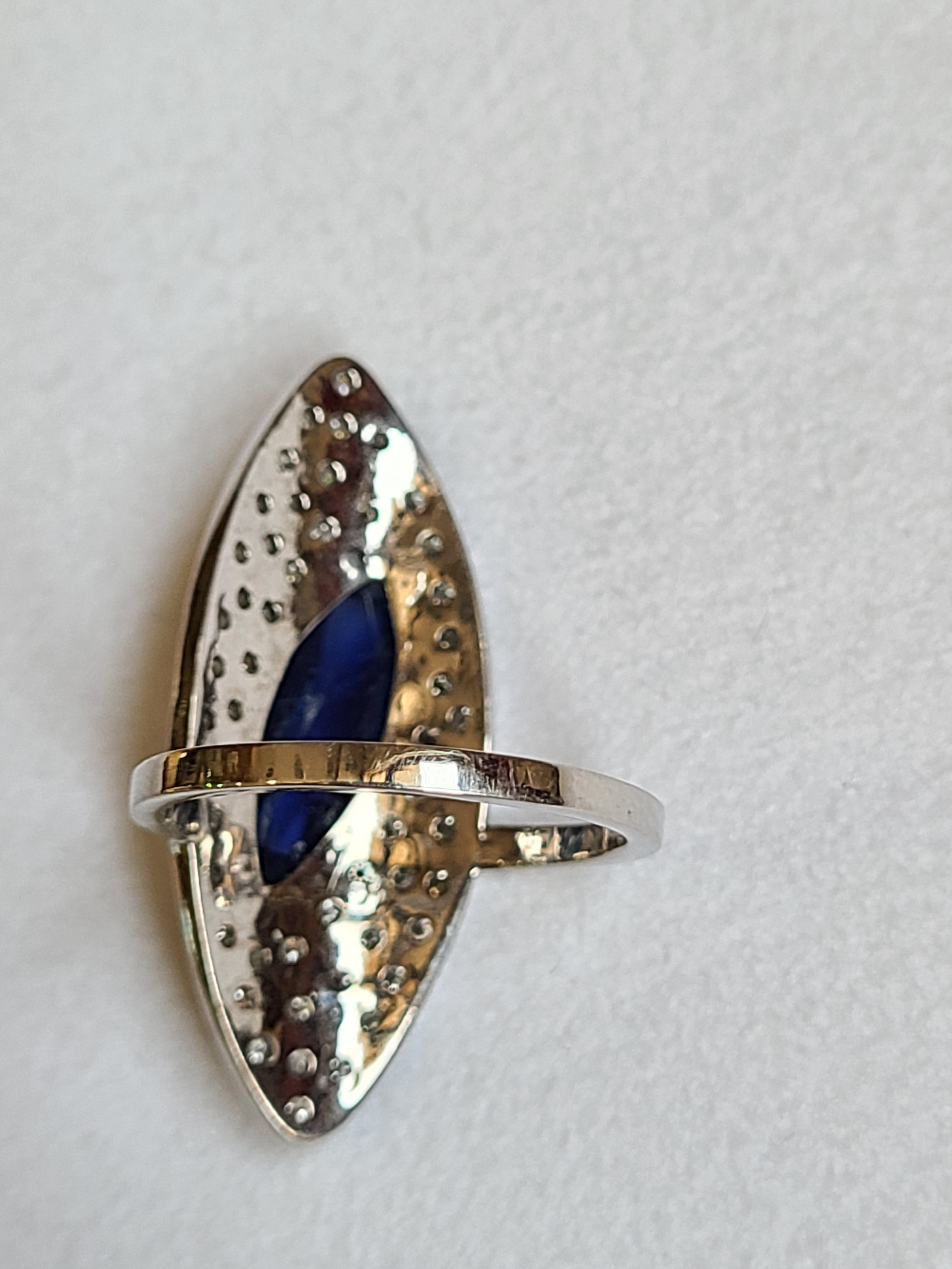 Marquise Cut 2.92 Carat Blue Sapphire Ring Set in 18 Karat Gold with Diamonds