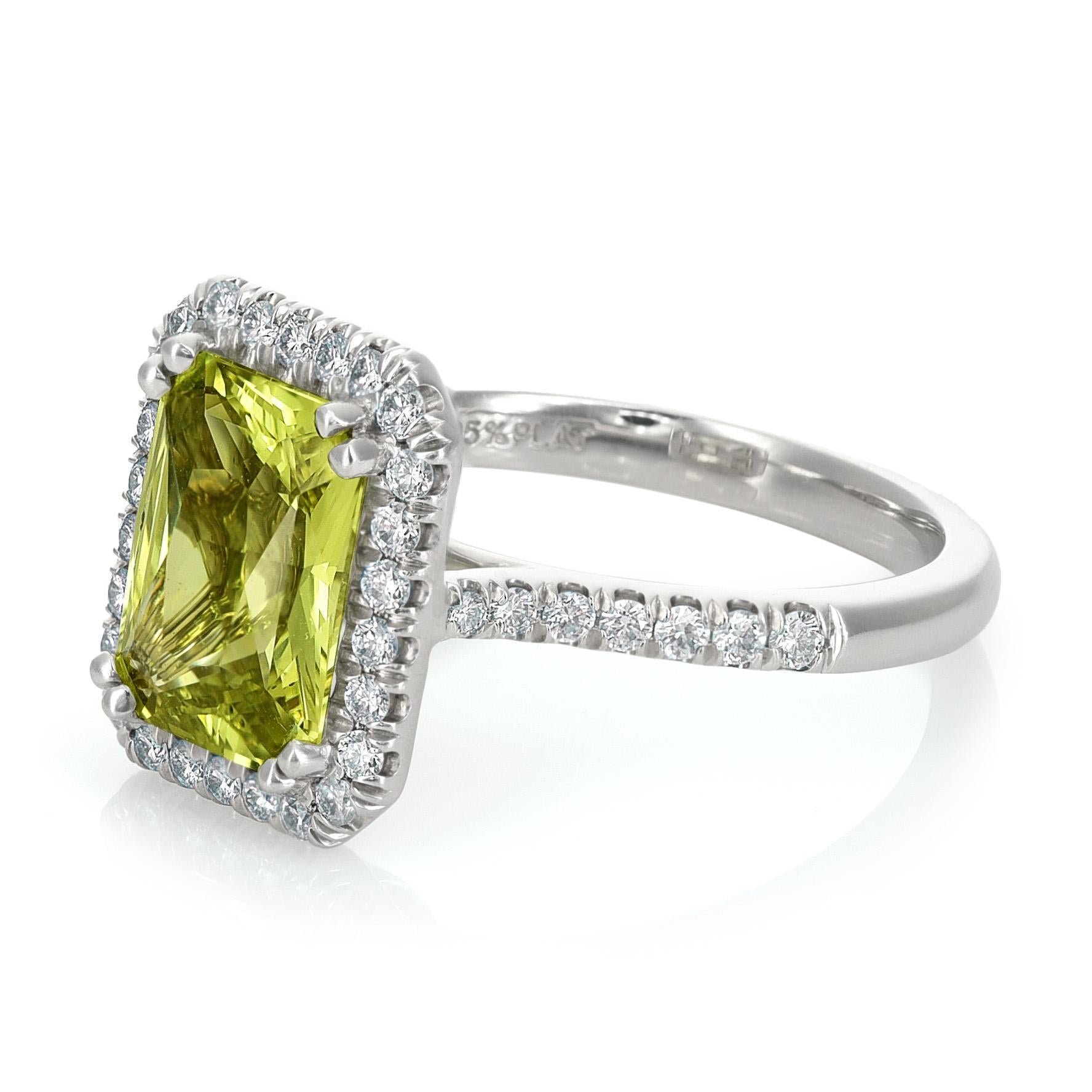 Indulge in sophistication with this Platinum Ring featuring a 2.92 carats Natural Chrysoberyl in a captivating emerald cut. The warm tones of the Chrysoberyl are enhanced through a meticulous heating process, elevating its inherent beauty.