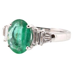 Retro 2.92 carats oval emerald from Colombia and diamonds ring