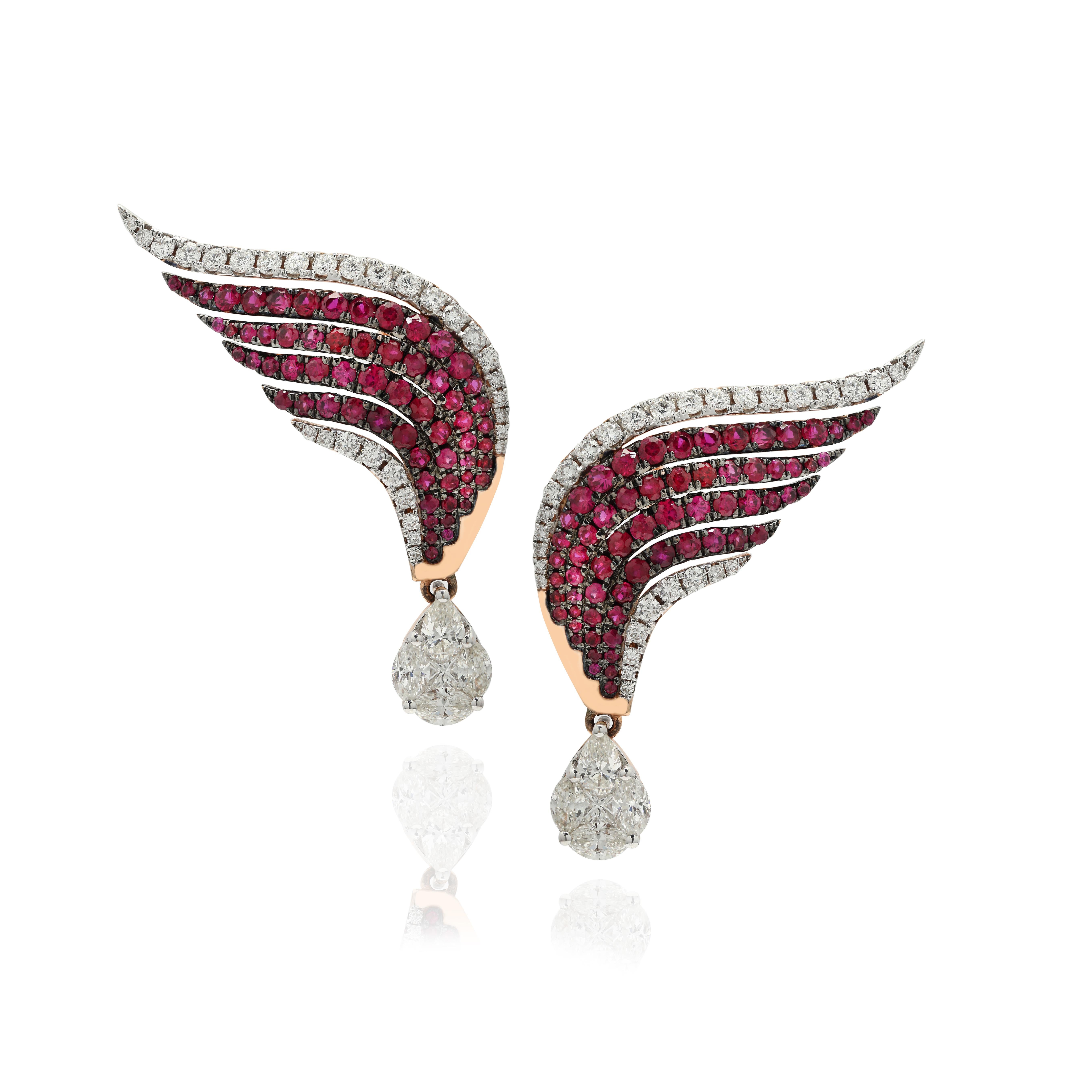 Ruby and diamond dangle earrings to make a statement with your look. These earrings create a sparkling, luxurious look featuring round cut gemstone.
If you love to gravitate towards unique styles, this piece of jewelry is perfect for you.

PRODUCT