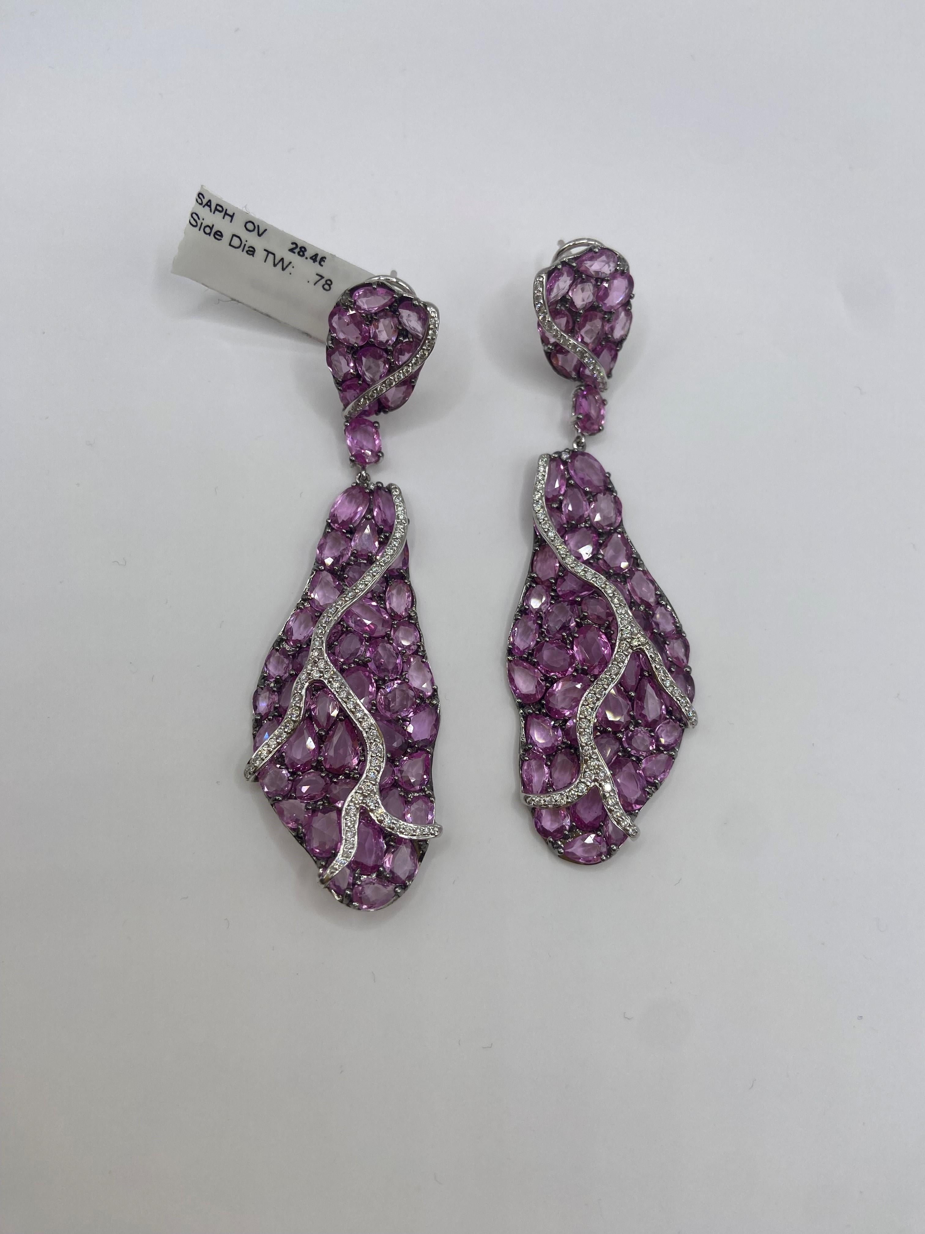 •	18KT White Gold
•	29.24 Carats

•	146 Round Diamonds: 0.78ctw
•	Color: F
•	Clarity SI1

•	Number of Rose Cut Pink Sapphires: 100
•	Carat Weight: 28.46ctw

This pair of earrings is made with 100 rose cut light pink sapphires, weighing 28.46 carats.