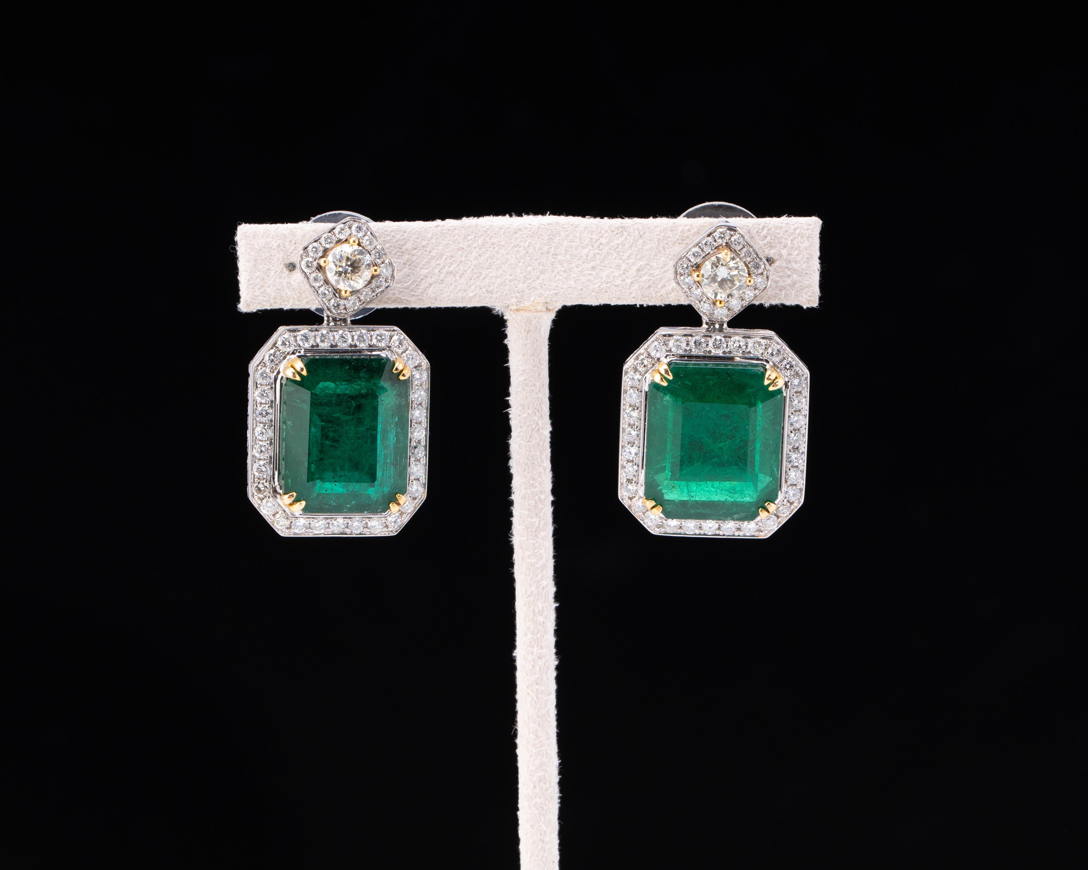 Earring :Em 2p/29.29cts Y Dia 2p/0.96ct  Dia 1.93ct 18k 13.61g

Make a statement with this pair of 29.29 carat Emerald Cut, Zambian Emerald earrings, transparent with few natural inclusions. These are a classic piece, The emeralds are absolutely