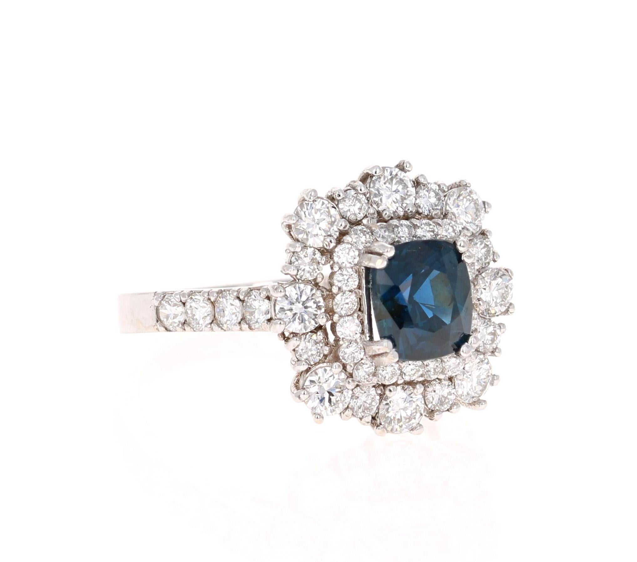 Beautiful Sapphire Diamond ring with an intricate setting! 

This ring has a Blue Sapphire that weighs 1.54 Carats and is GIA Certified. The Sapphire is a natural Blue Cushion Cut with NO indications of heating. The GIA Certificate Number is: