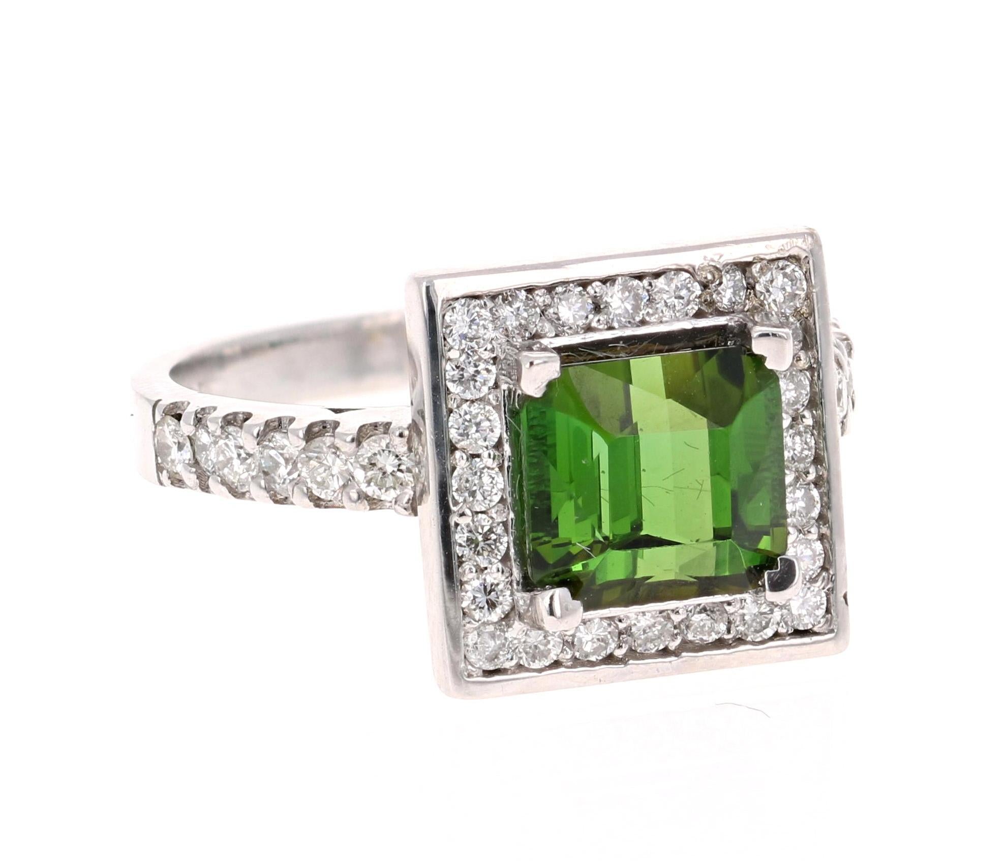 
This stunner has a Square Cut Green Tourmaline that weighs 2.31 Carats. The Tourmaline is surrounded by 36 Round Cut Diamonds weighing 0.62 Carats.  The total carat weight of the ring is 2.93 Carats. 

The ring is made in 14 Karat White Gold and