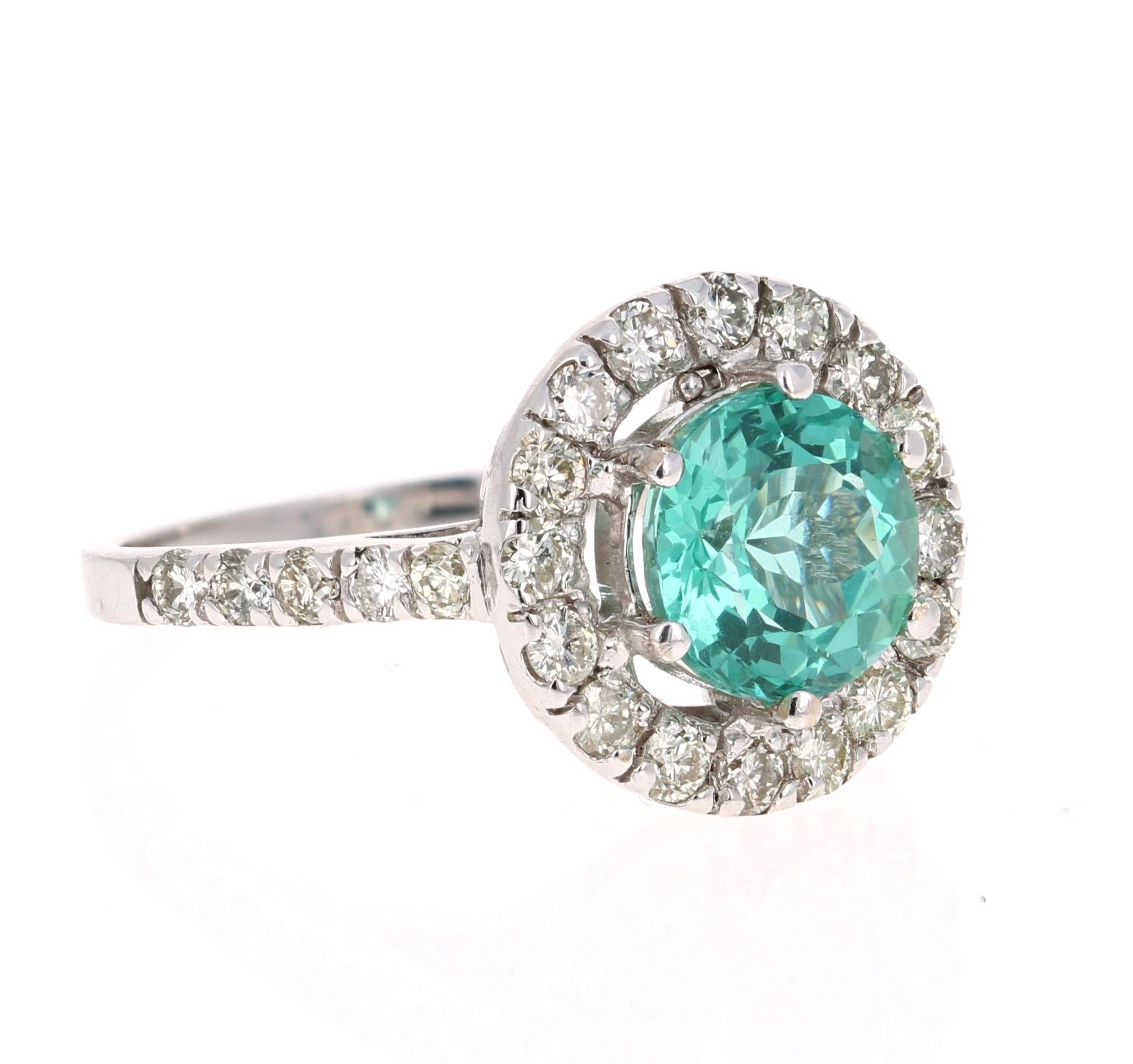Gorgeous Halo Apatite and Diamond Ring.  This ring has a Round Cut 1.91 Carat Apatite and is surrounded by a halo of 50 Round Cut Diamonds that weigh 1.02 carat (Clarity: VS, Color: F).  The total carat weight of the ring is 2.93 Carats.  

Apatites