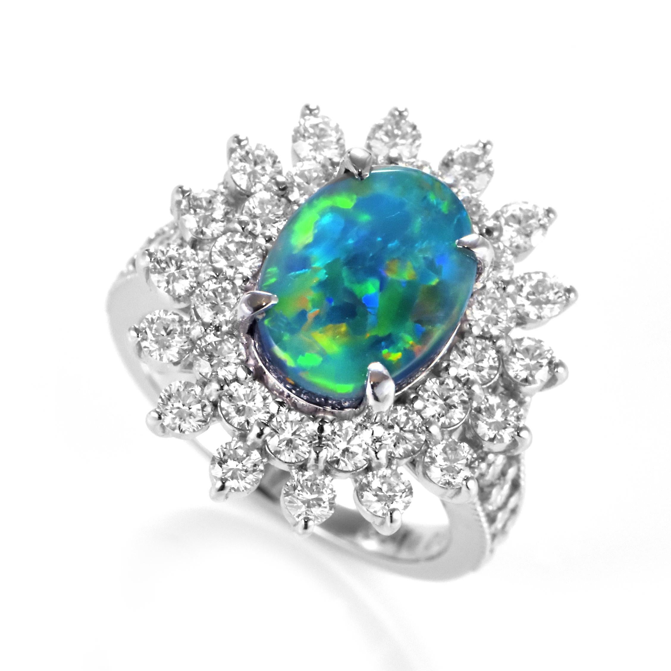 A beautiful ring featuring a 2.932 Carat Australian Black Opal and 1.83 Carat Diamonds made in Platinum. The Opal displays very good play of color! Opals are known for exhibiting flashes of rainbow colors known as 
