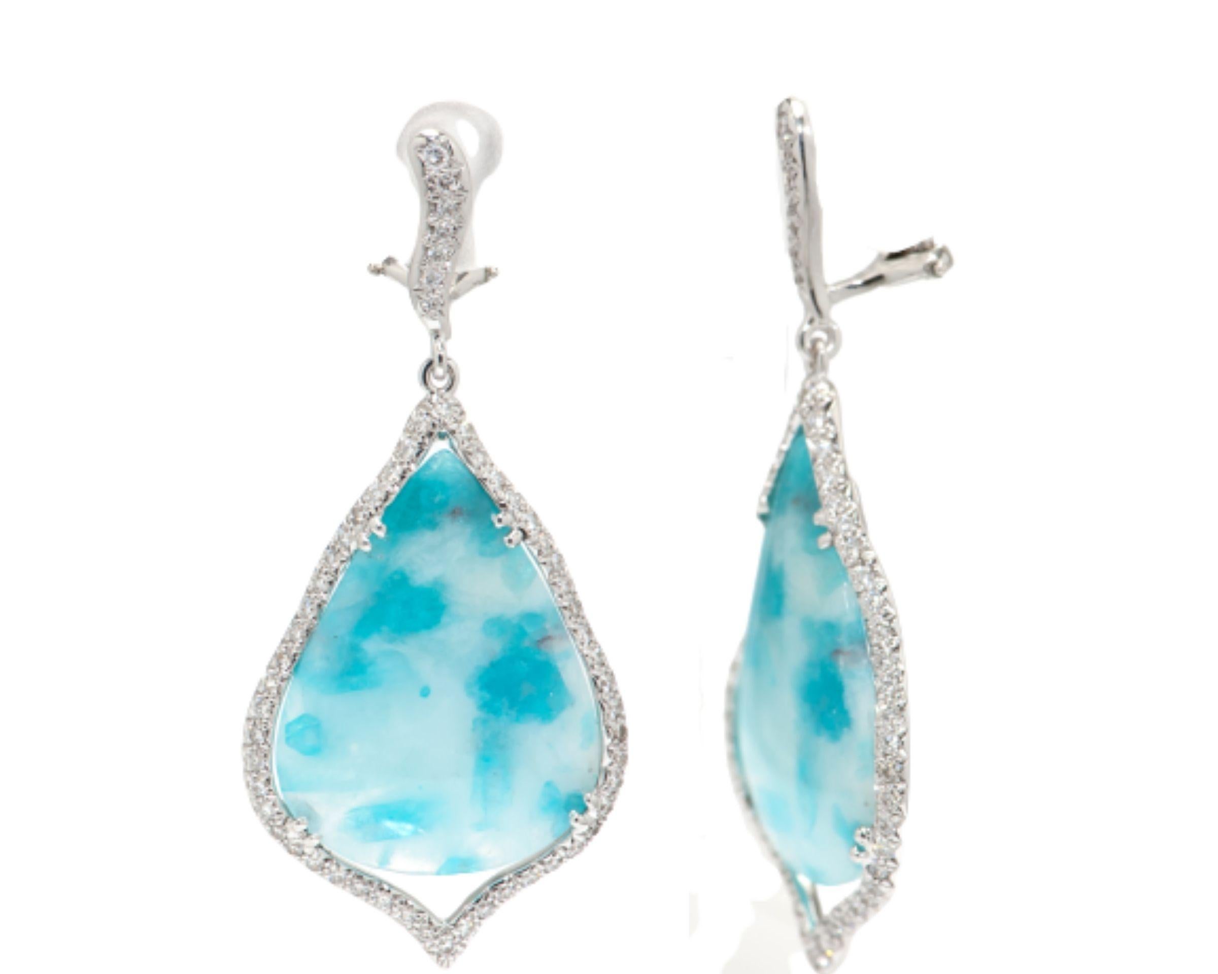 Beautiful pair of Chandelier Dangle Earrings set with Tear Drop Paraiba Tourmaline Gemstones from Brazil; measuring approx. 33.14 x 21.04mm and 26.63 x 19.74mm, surrounded by round brilliant cut diamonds. Hand crafted in 18K white Gold. Classic and