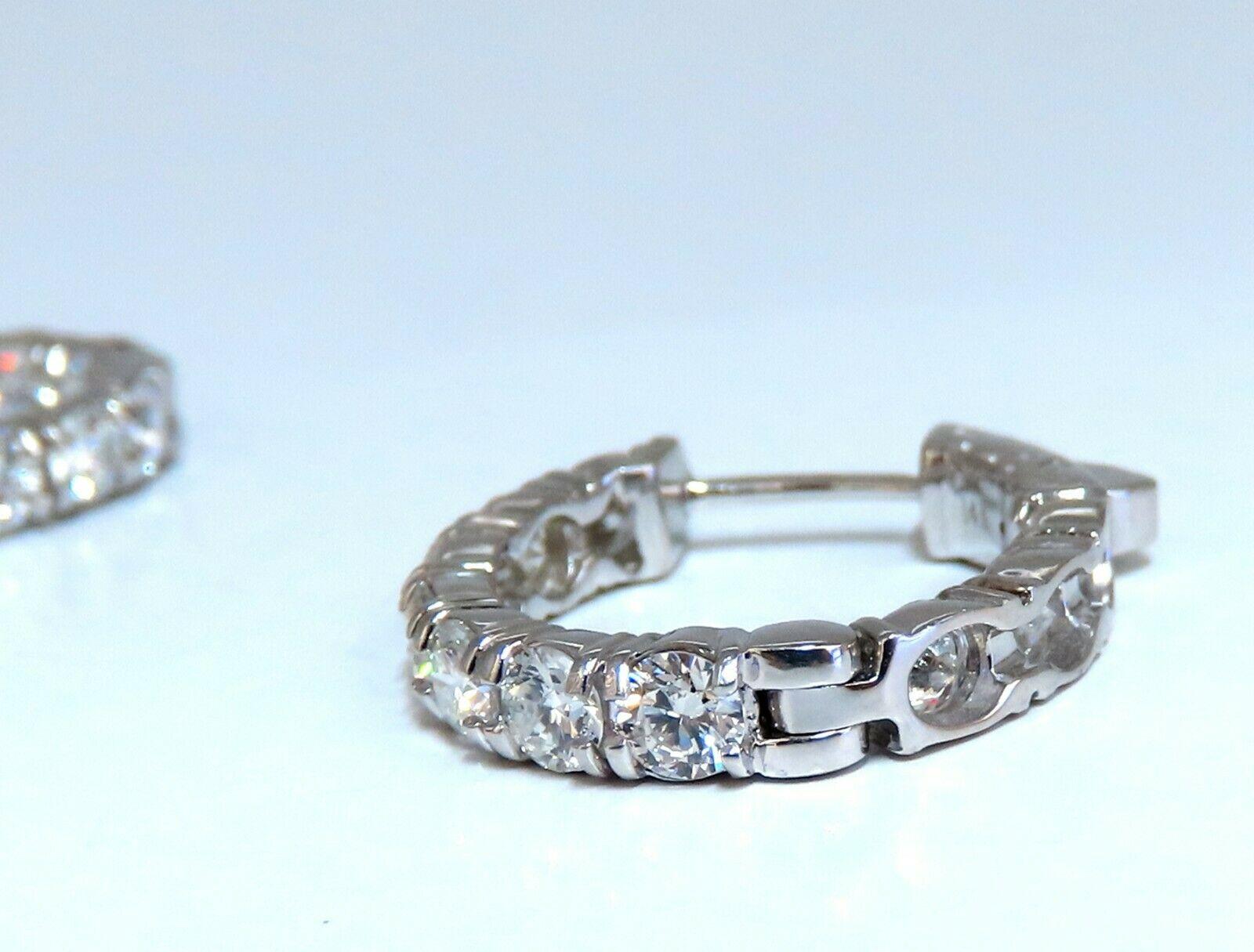 Elongated natural diamond hoop earrings.

Sharing prong design

2.93 carat round brilliant diamonds

G color vs2 clarity

14 karat white gold 6.1gram

20mm wide front to back

20mm top to bottom

3.7 mm thick at Diamond row

Push button snap