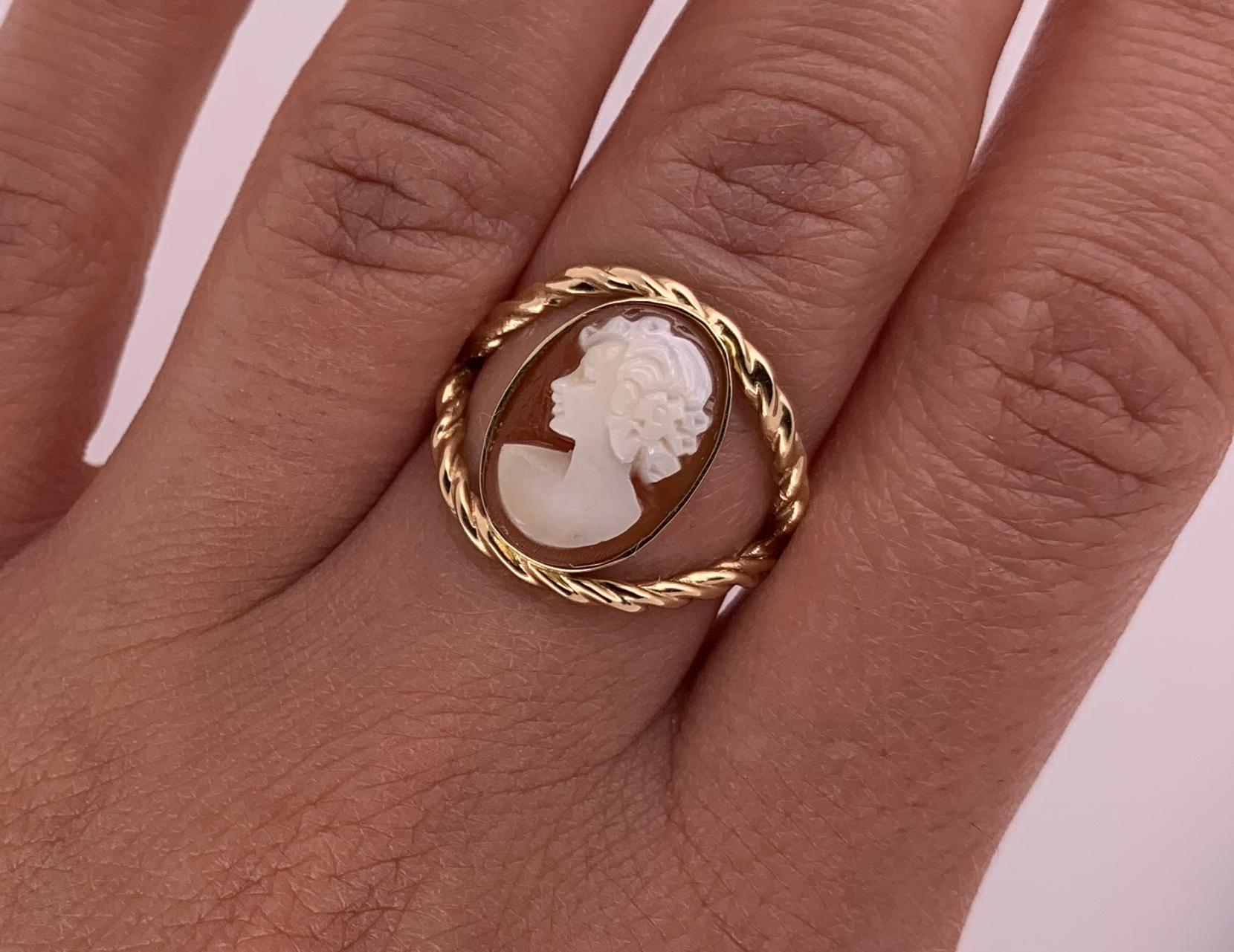 A Classic Cameo Ring- Including a beautiful woman's silhouette 
Material: 14K Yellow Gold
Gemstone Details: 1 Oval Shaped Cameo at 2.94 Carats- Measuring 10.4 x 14.3 mm

Ring Size: 5.5. Alberto offers complimentary sizing on all rings.

Fine