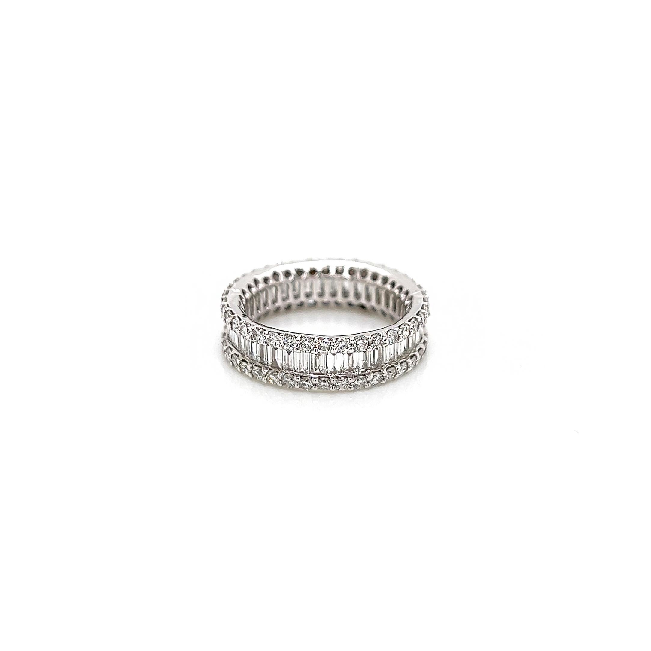 2.94 Carat Channel and Prong-Set Diamond Eternity Band

-Metal Type: 18K White Gold
-2.94 Carat Baguette and Round Natural Diamonds
          ~Baguette Stones: F-G Color, VS Clarity 
          ~Round Stones: F-G Color, SI Clarity 

-Size 6.5

Made