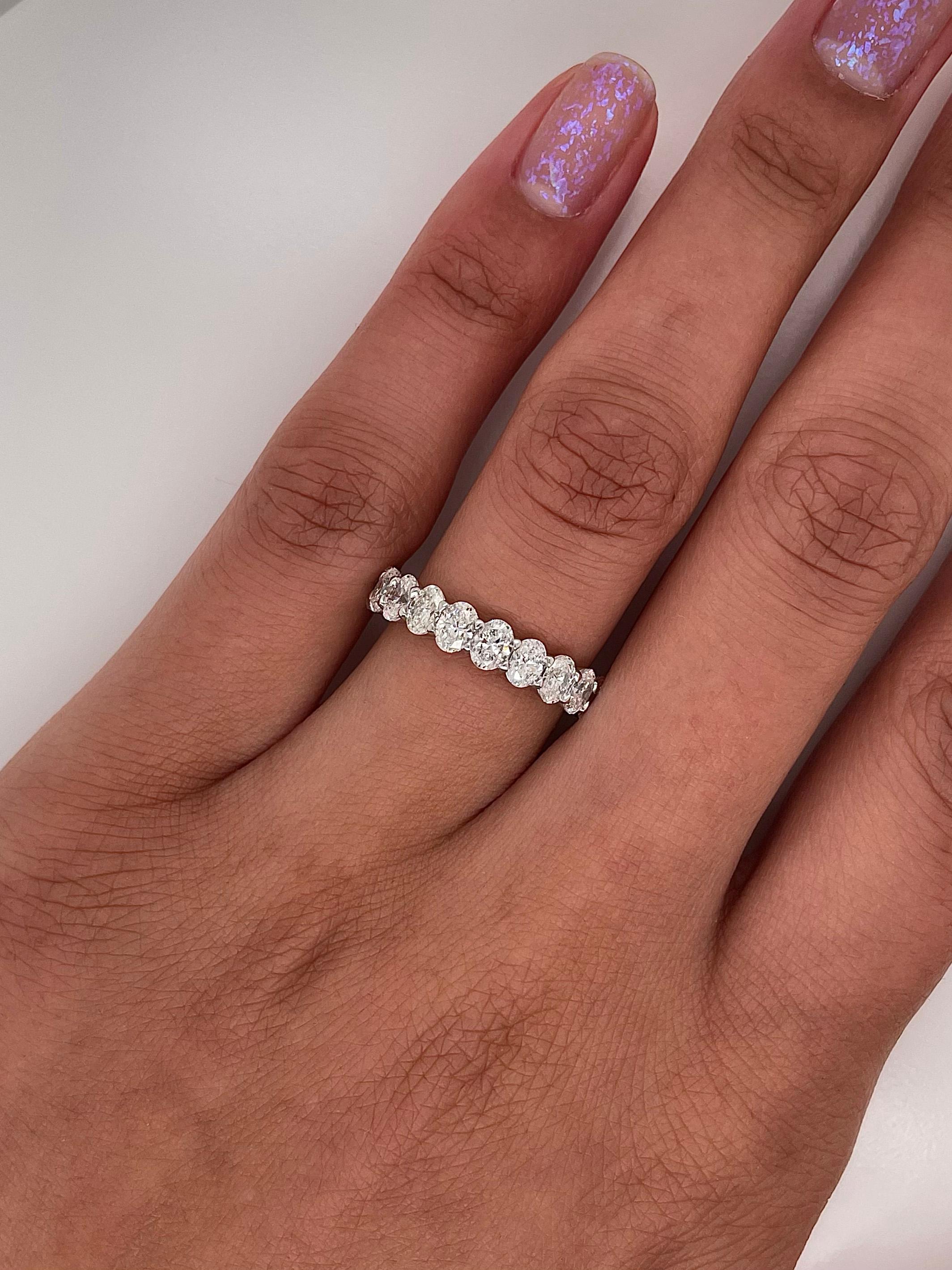 Ladies diamond Eternity band carries 2.94 total Carats of oval cut diamonds placed in platinum. 

Size: 6.0
Color: G
Clarity: VS

This shared prong style Eternity band was handmade by our jewelers in New York City.