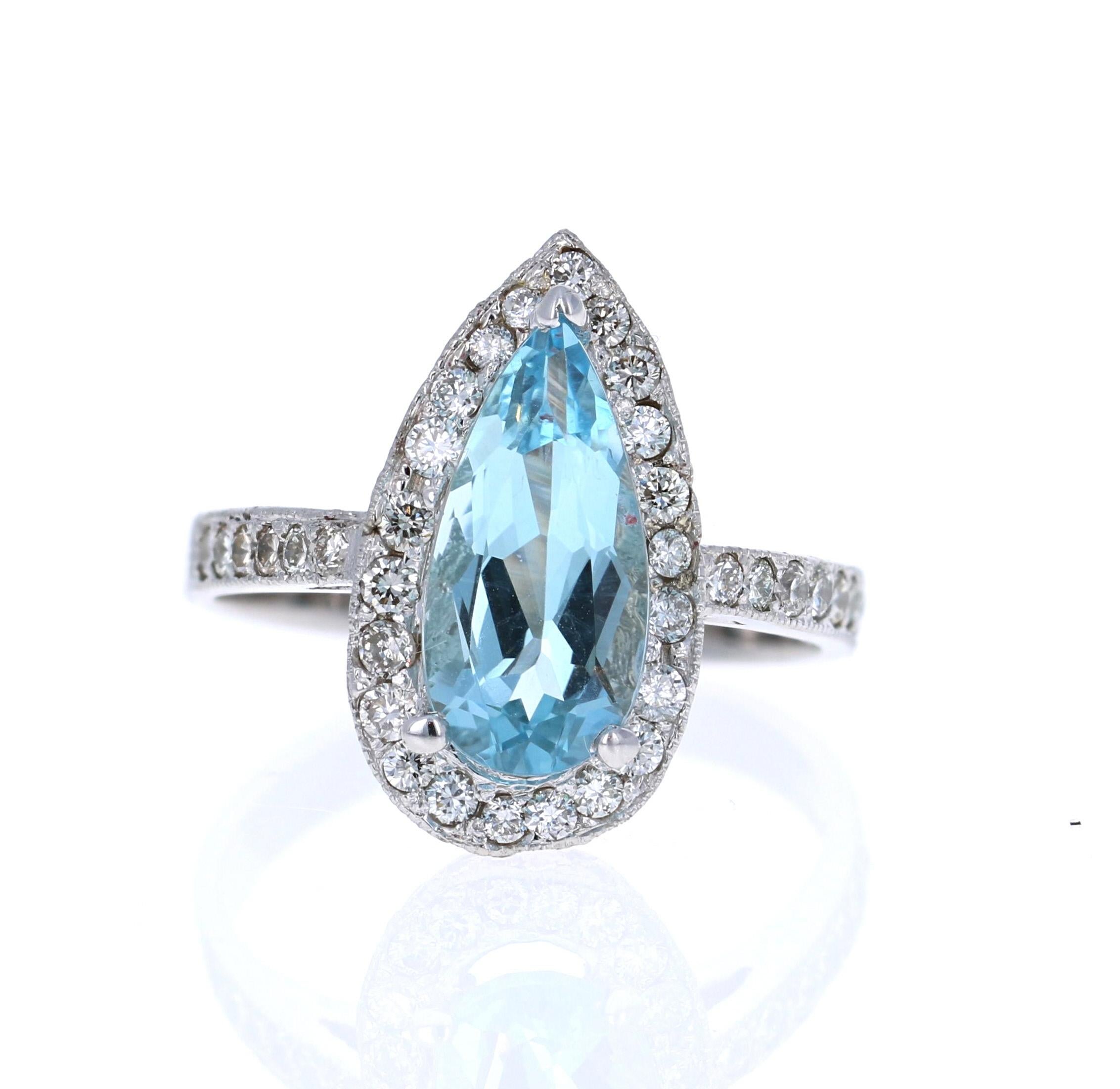 Stunning and Classic Pear Cut Aquamarine and Diamond Masterpiece
This ring has a beautiful 1.95 Carat Pear Cut Aquamarine set in the center of the ring and is surrounded by a Halo of 38 Round Cut Diamonds that weigh 1.00 Carats.  The Total Carat
