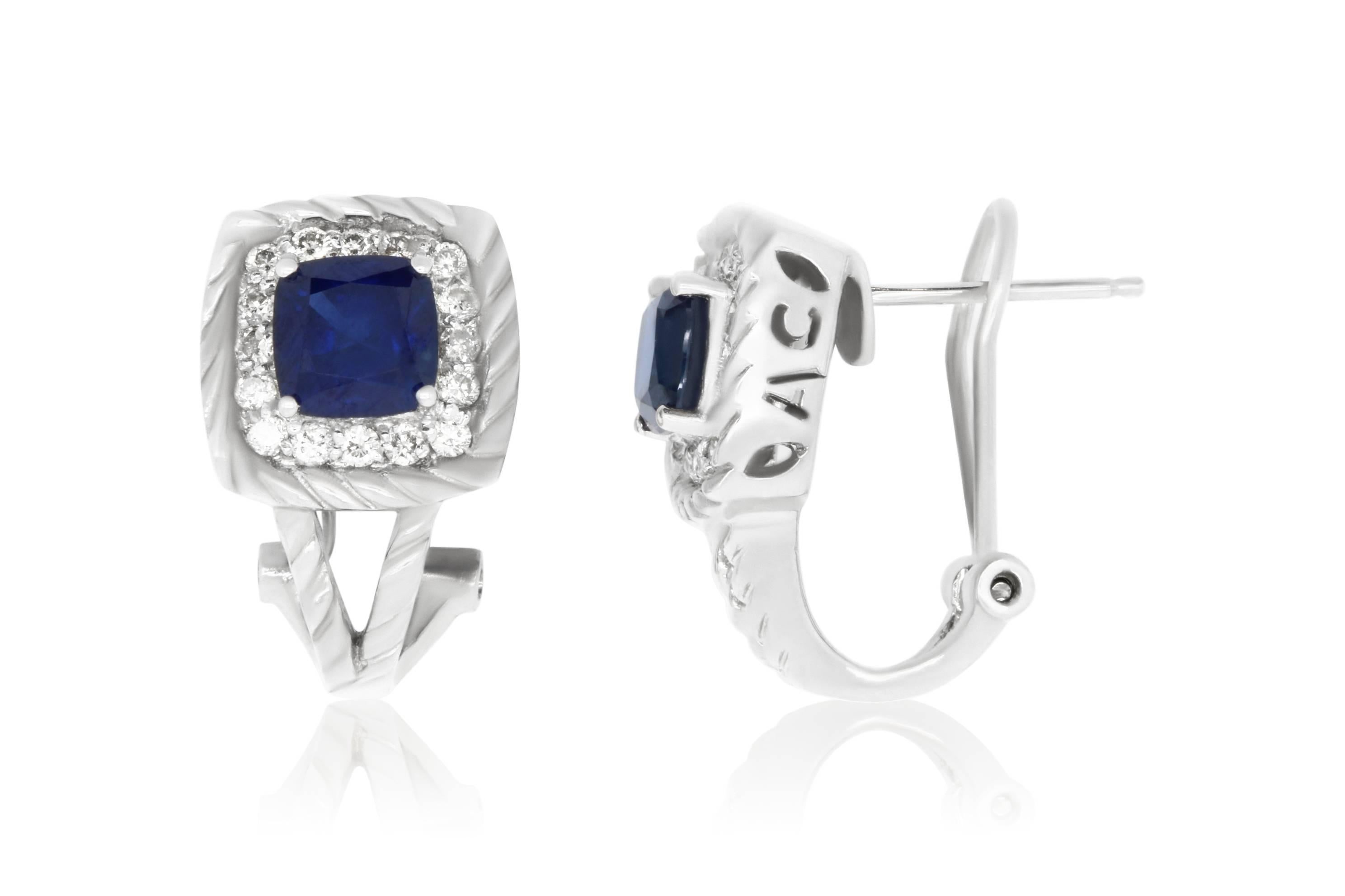 Material: 14k White Gold 
Stone Details: 2 Cushion Blue Sapphires at 2.95 Carats Total
32 Round White Diamonds at .55 Carats. Clarity: SI / Color: H-I

Fine one-of-a kind craftsmanship meets incredible quality in this breathtaking piece of