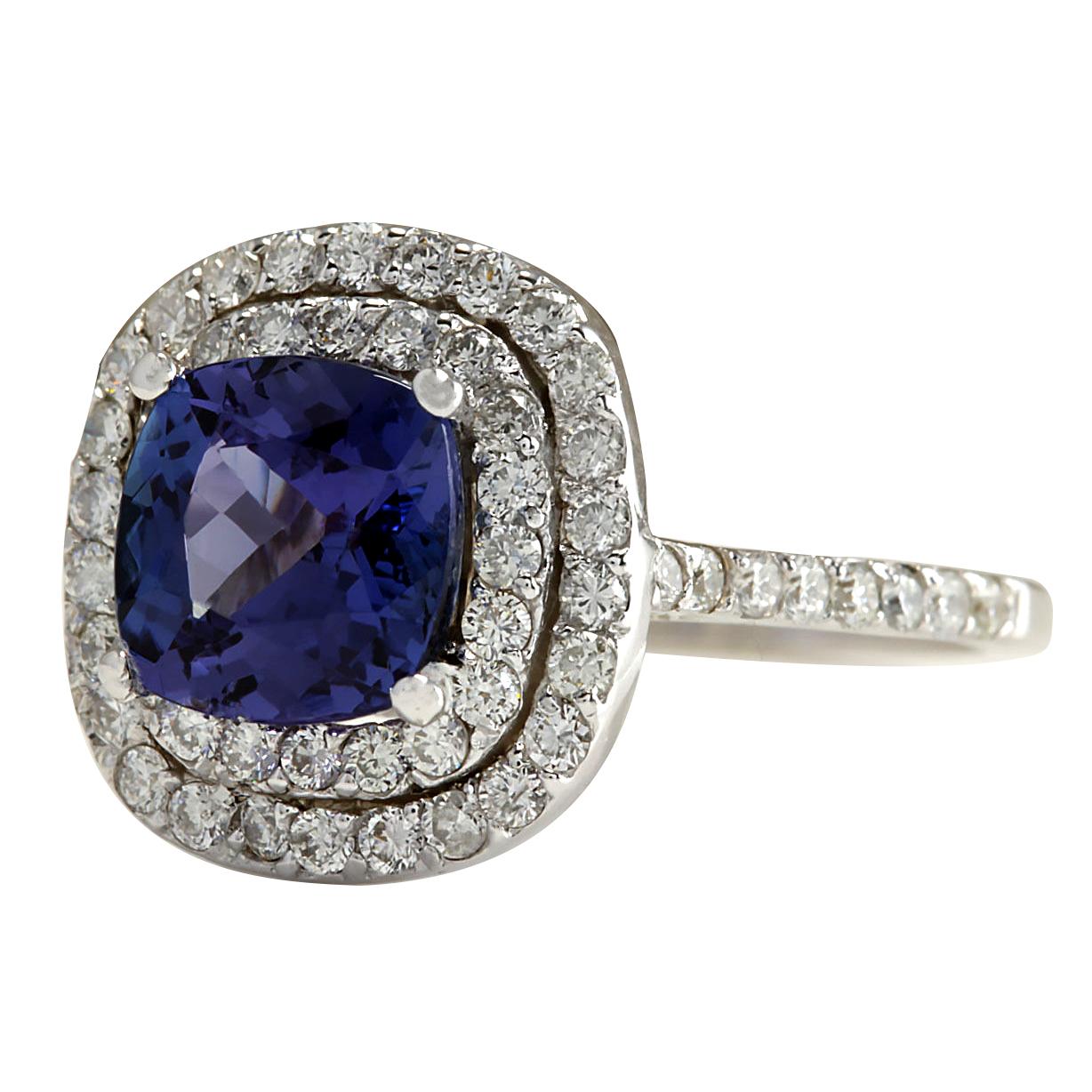 2.95 Carat Natural Tanzanite 14 Karat White Gold Diamond Ring
Stamped: 14K White Gold
Total Ring Weight: 4.0 Grams
Total Natural Tanzanite Weight is 1.97 Carat (Measures: 7.50x7.50 mm)
Color: Blue
Total Natural Diamond Weight is 0.98 Carat
Color: