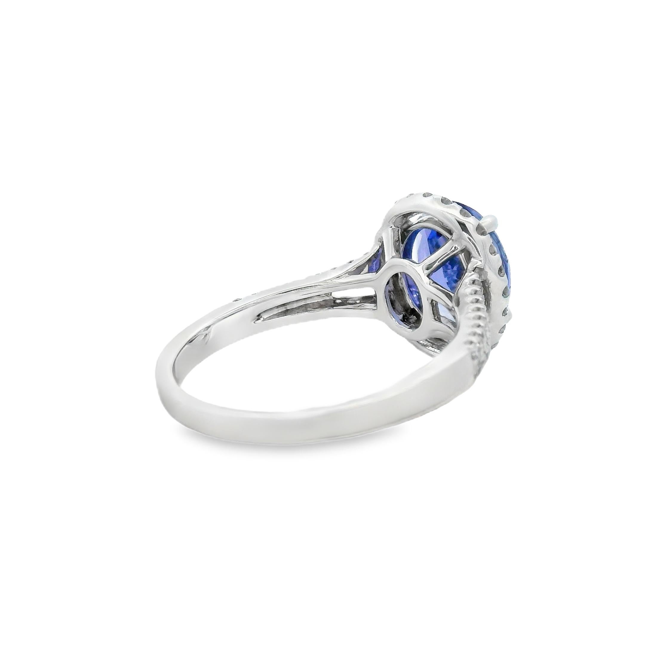 Femenino o masculino Anillo halo de tanzanita ovalada y diamante de 2,95 quilates en oro blanco de 10 quilates talla 7 en venta
