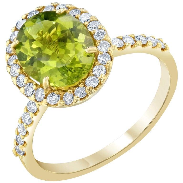 14 Karat Yellow Gold Bezel Set Peridot Ring at 1stDibs