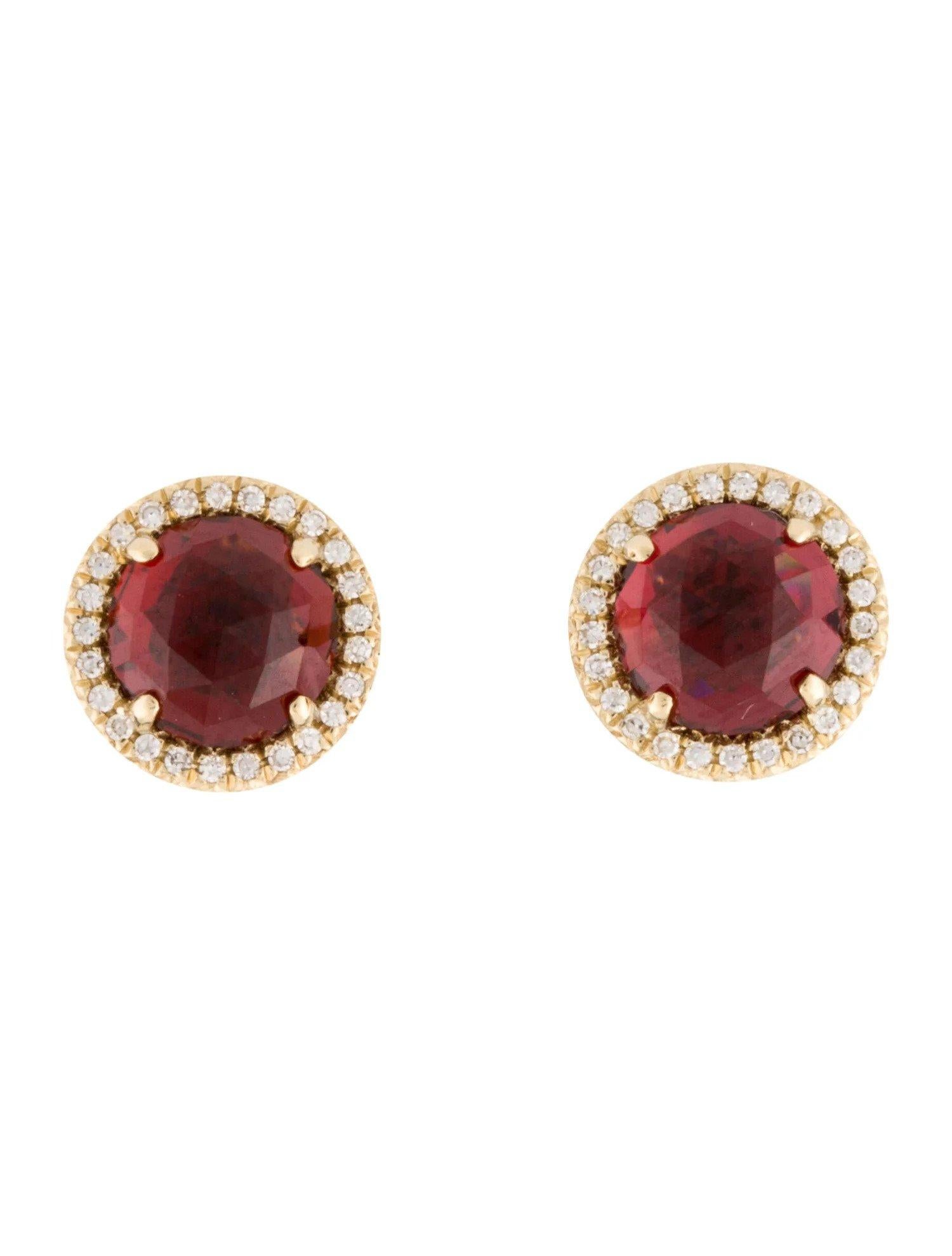 These Garnet & Diamond Earrings are a stunning and timeless accessory that can add a touch of glamour and sophistication to any outfit. 

These earrings each feature a 1.50 Carat Round Garnet , with a Diamond Halo comprised of 0.06 Carats of Single