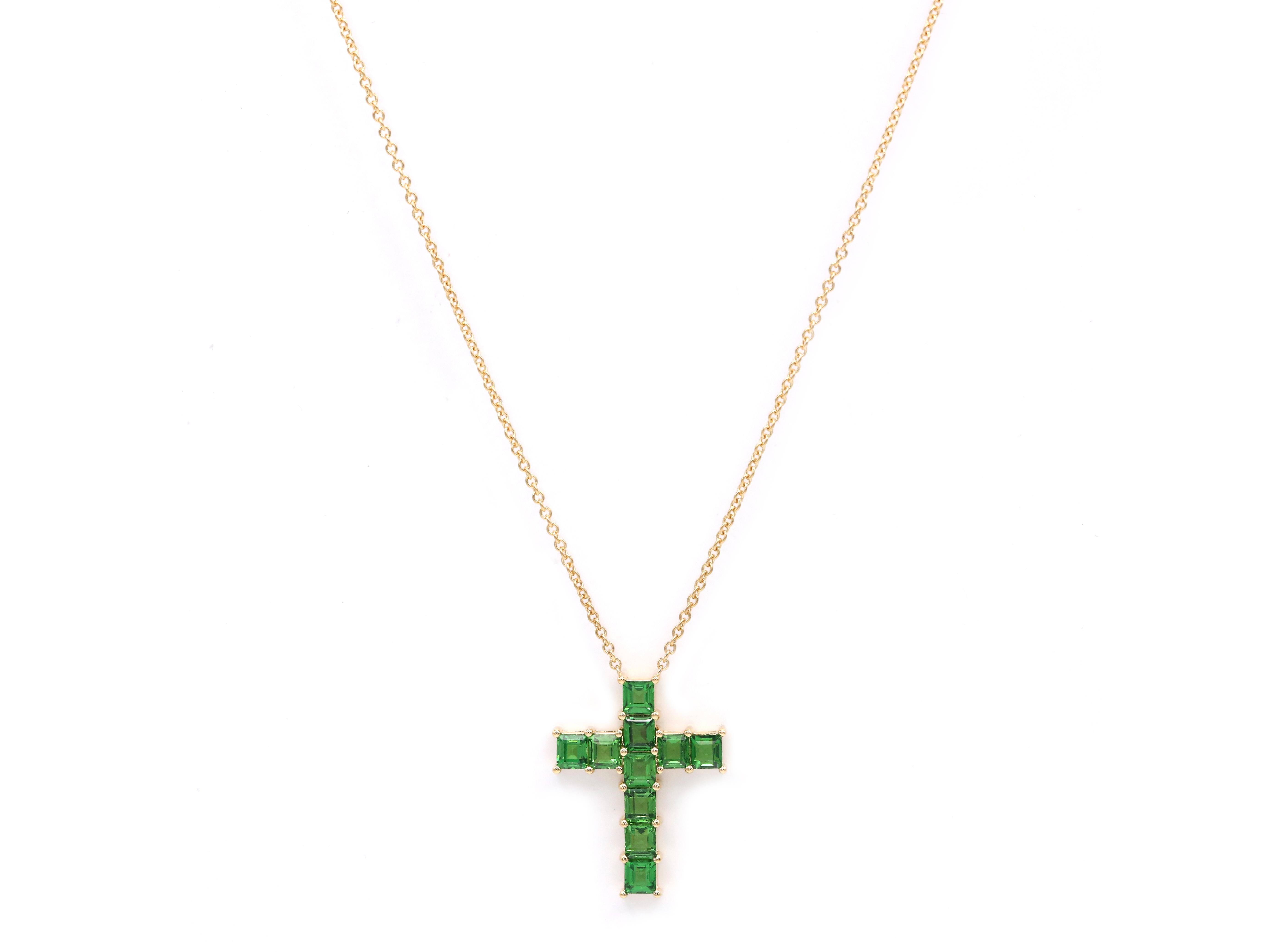 This stunning 2.95 Carat Tsavorite 18K Yellow Gold Cross features a modern design that brings a fresh take on classics, at the same time it is made according to the tradition of the Christian church.
Deep green tsavorite color will emphasize your
