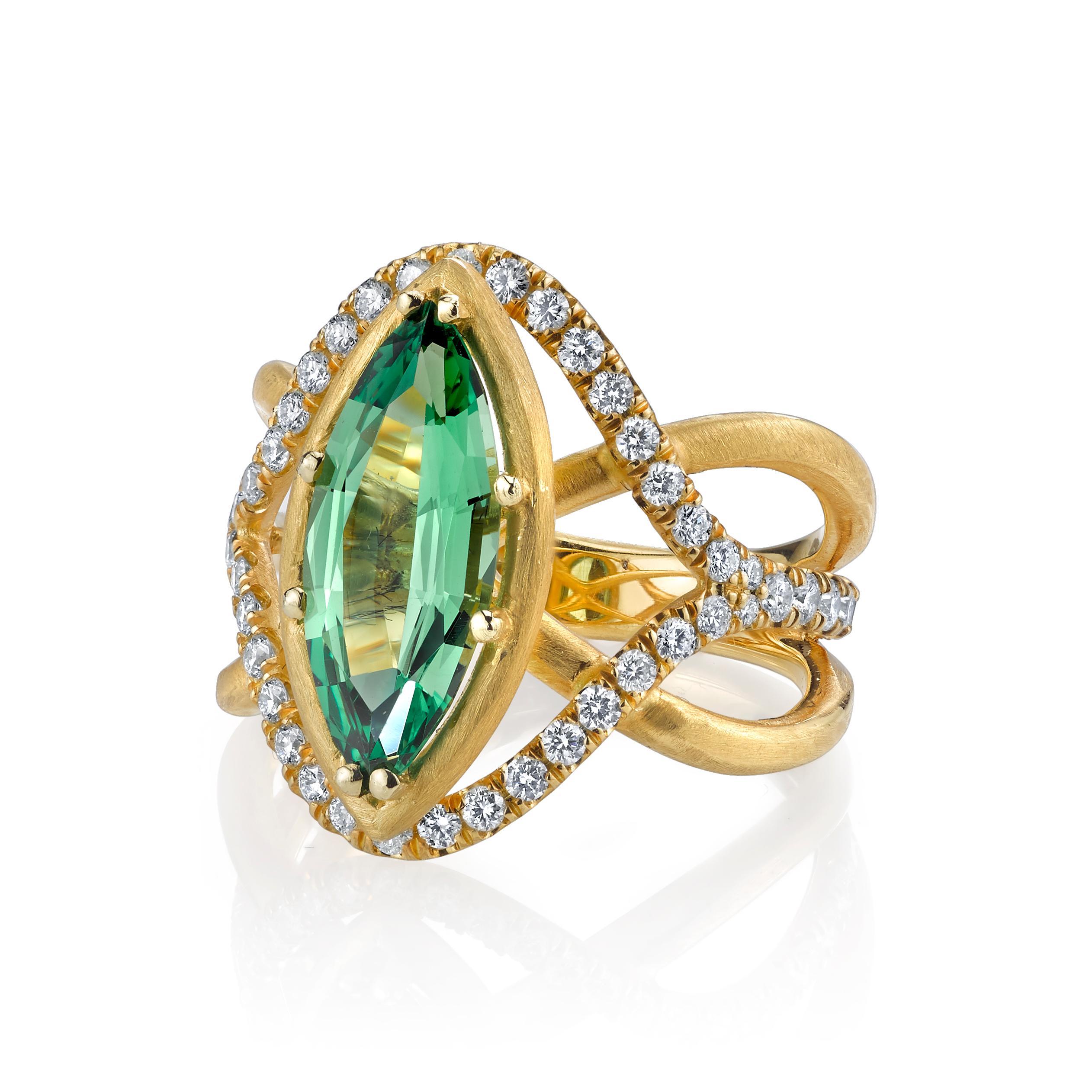 This elegant 18k yellow gold ring looks so sophisticated and refined! Artfully designed with flowing curves and beautiful from every angle, this original work of art features a 2.95 carat bright and vivid tsavorite green garnet in an unusual