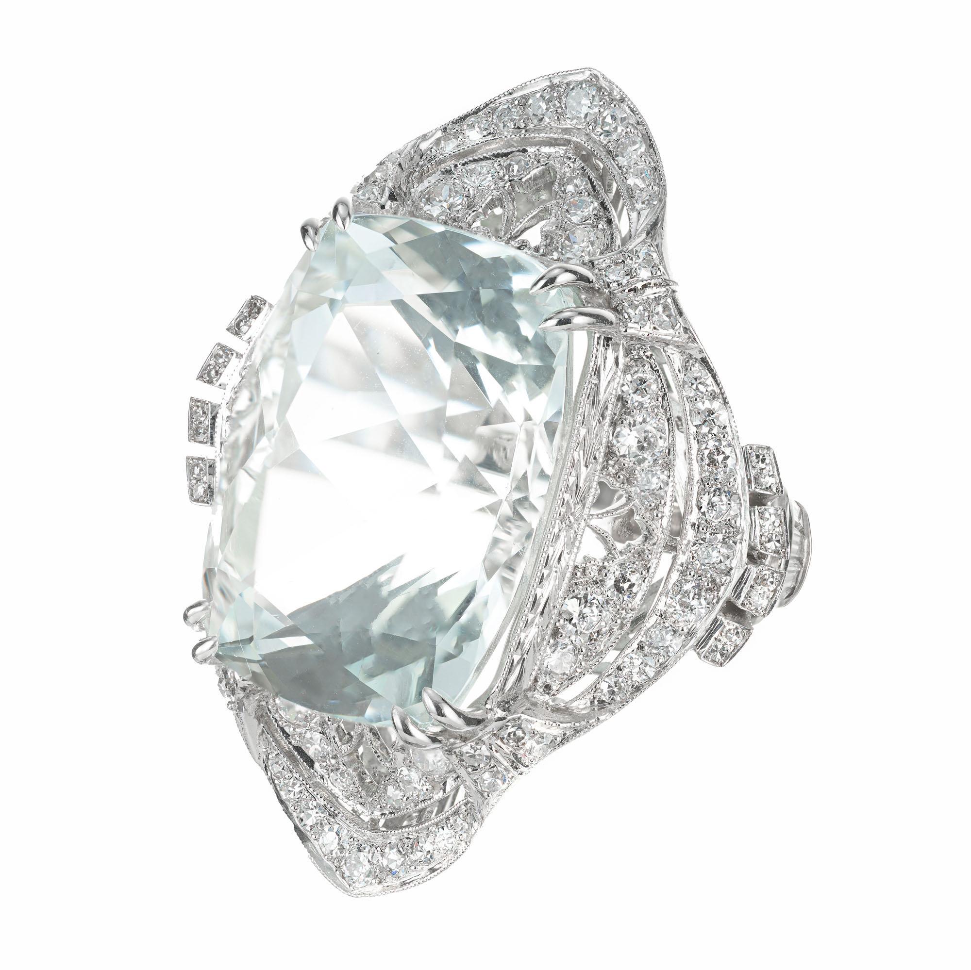 Large cushion brilliant cut pale blue natural untreated aqua and diamond cocktail ring. 29.34ct Aquamarine in its original handmade, 1940's filigree, hand engraved platinum setting with 108 round brilliant cut diamonds and 12 step cut baguette