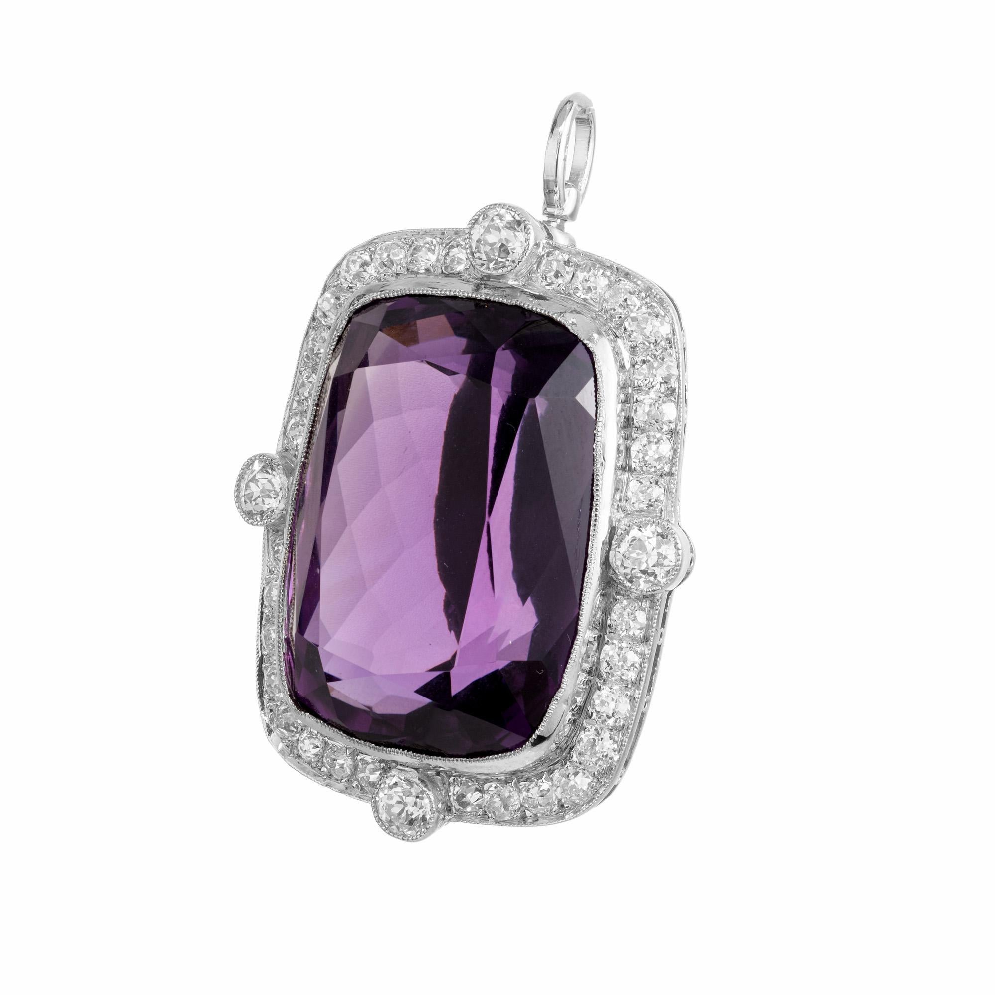 Vintage 1925 Art Deco amethyst and diamond brooch and pendant. This spectacular natural 29.54 carat a cushion cut Amethyst is mounted in a platinum frame with a halo of 36 old mine cut diamonds totaling 1.40cts. Crafted to perfection, this stunning