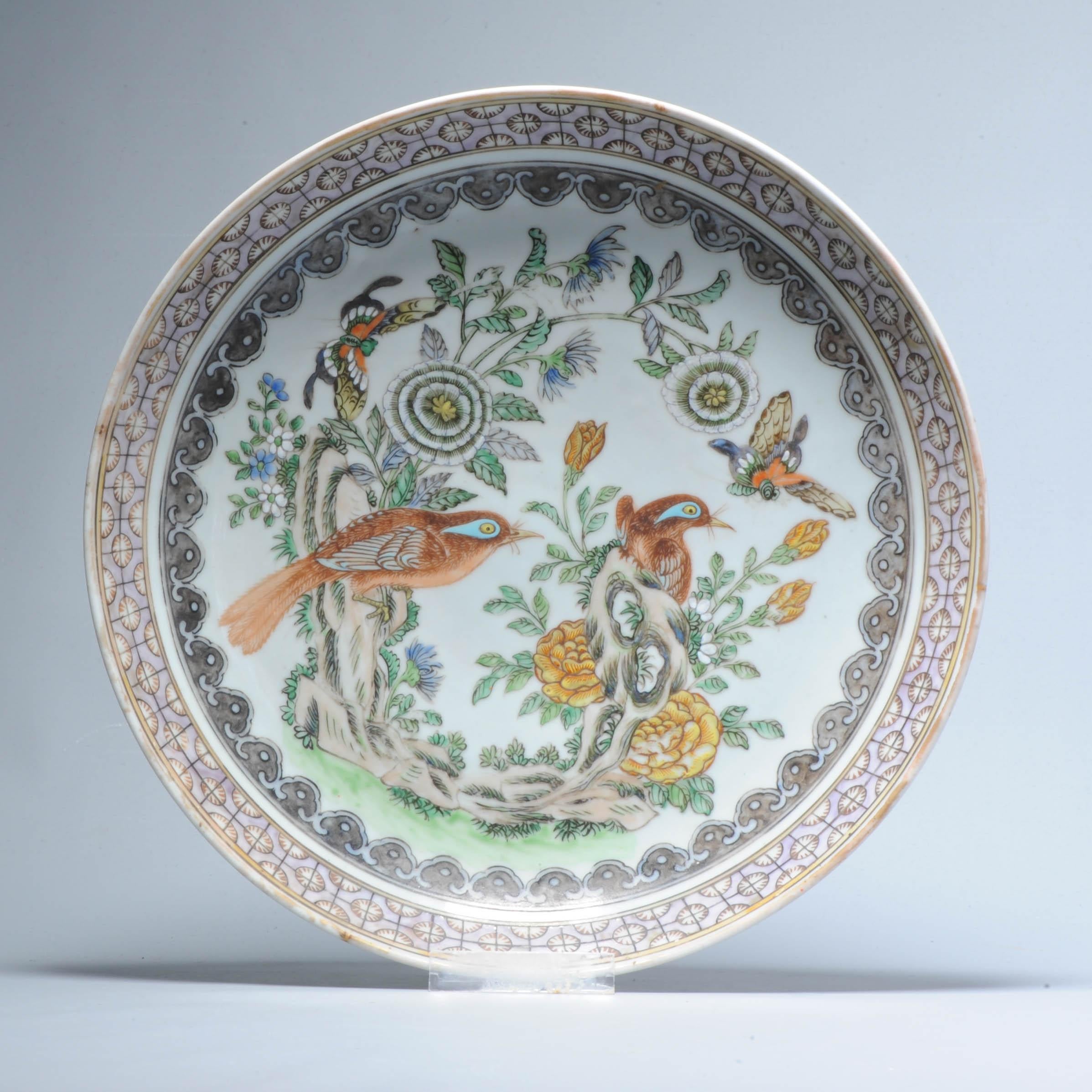 Superb antique Chinese porcelain Dish/Plate from the late qing period.

Painted in cantonese style with a fantastic landscape scene with birds, butterflies, flowers and geomtric design in the border.

The painting is of very high