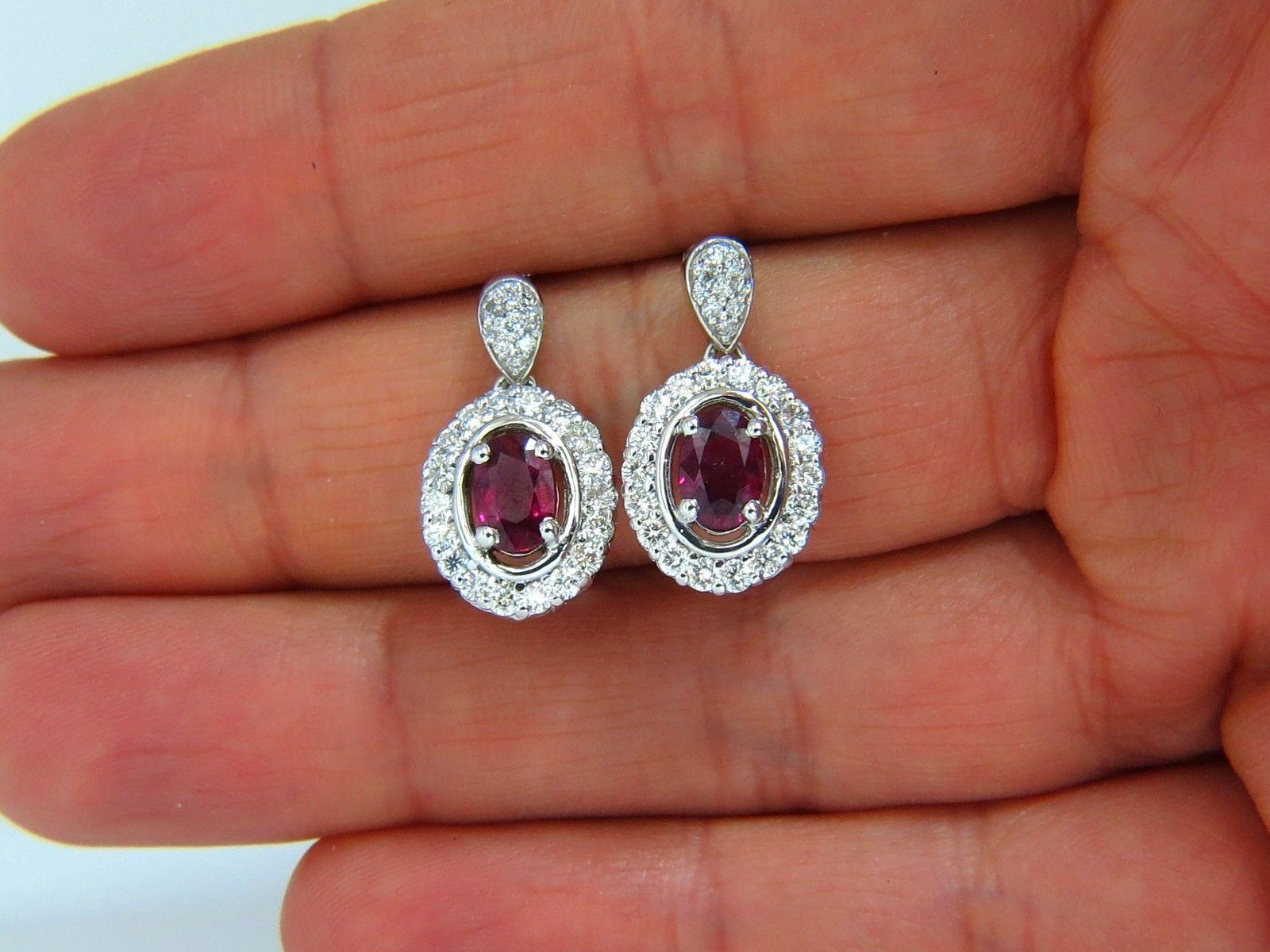 1.86ct. Natural Rubies & 1.10ct. diamonds dangle pendant earrings.

Rubies: oval cut, transparent & clean (si-1) clarity.

Fully faceted & gorgeous vivid purple red tone.

average range: 6.8 X 4.8mm



1.10cts of Side round diamonds: 

G-color, Vs-2