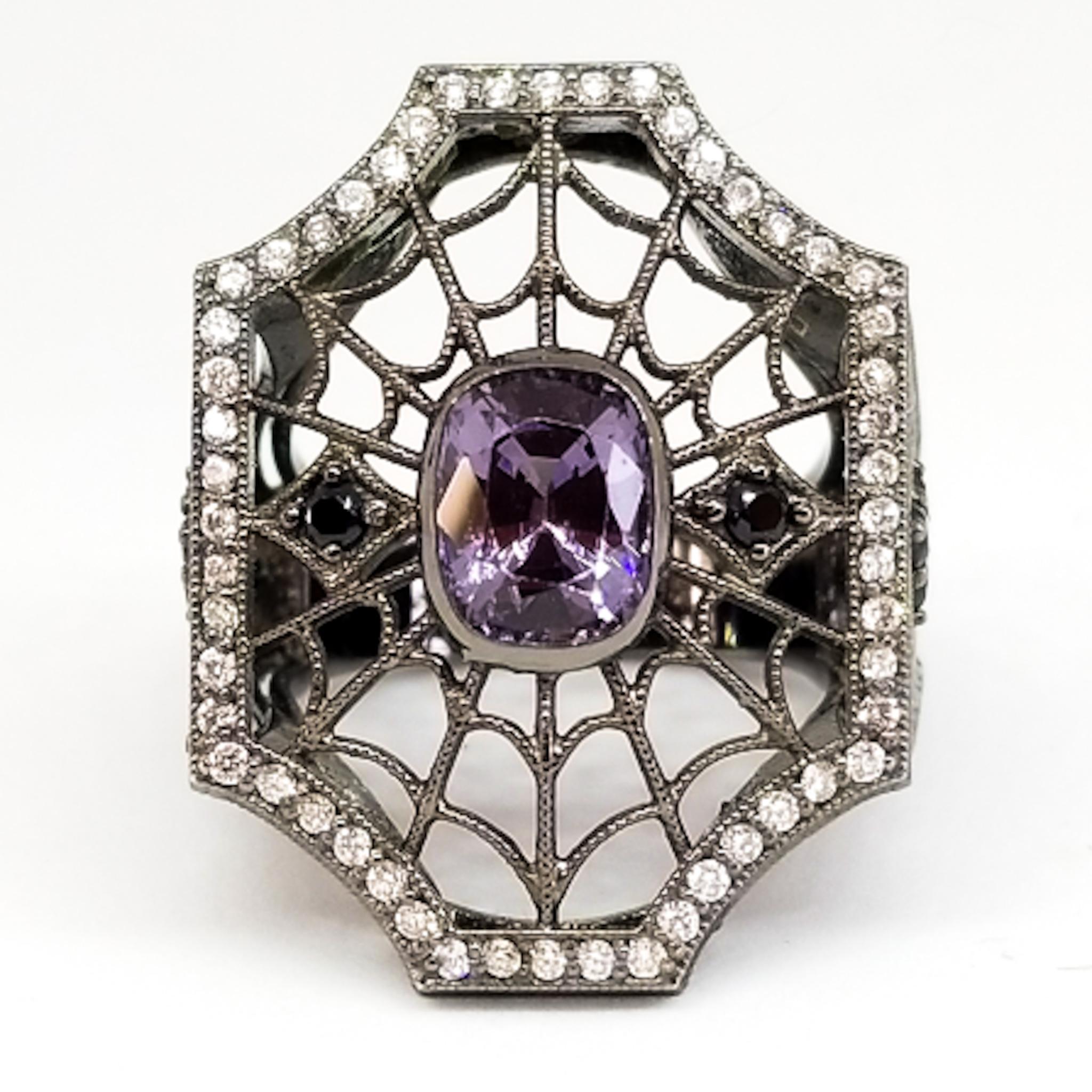 This one of a kind Ring by Tom Castor is a Large but Airy Statement Ring with Detail and Interest at every angle. The unisex ring in the Victorian Gothic, or Steampunk Style features a Spiderweb of openwork filigree and Millegrain Detail. The center