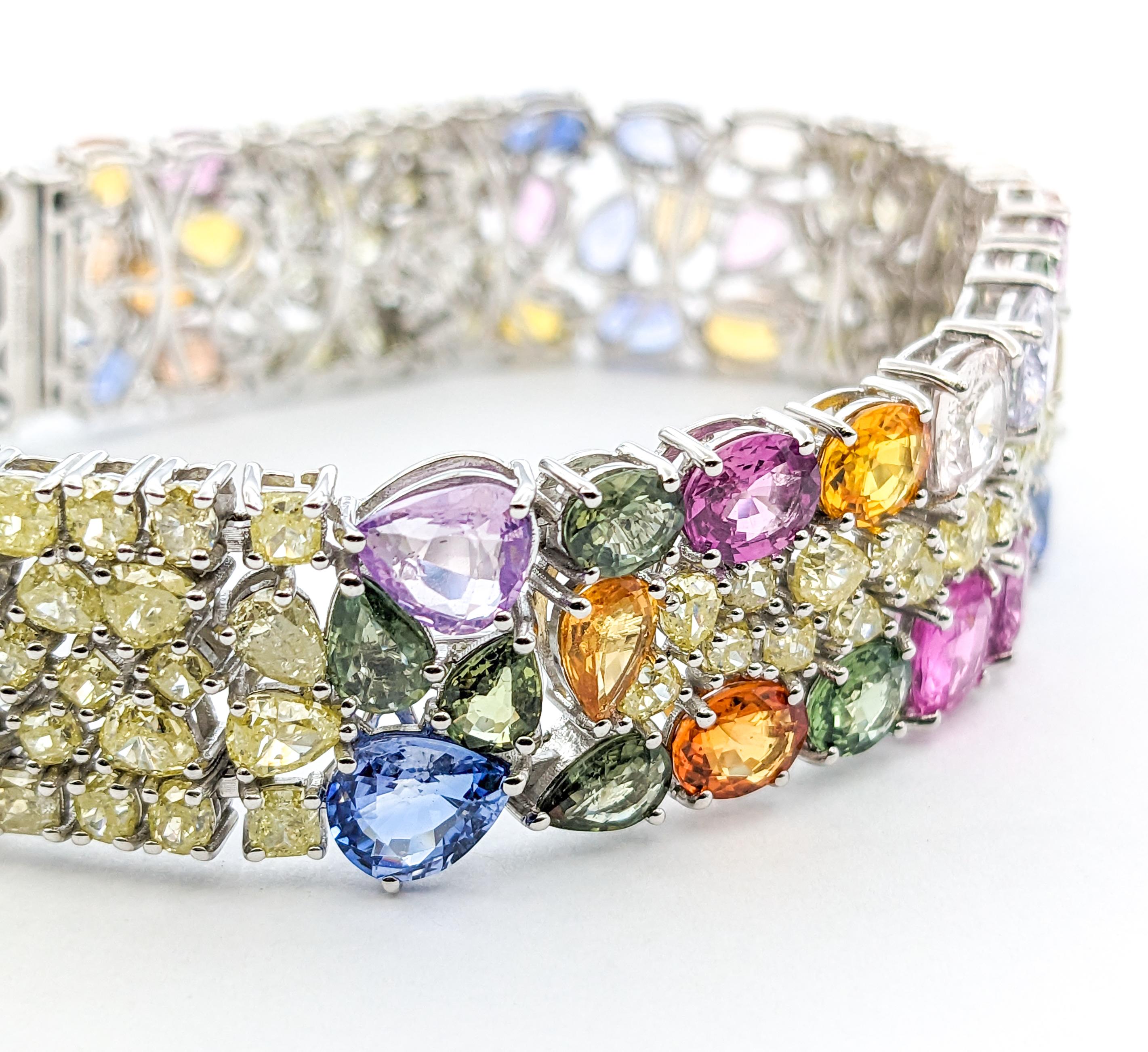 29.64ctw Multi-Color Sapphires & 13.50ctw Diamonds Bracelet In White Gold


This stunning Gemstone Fashion Bracelet, meticulously crafted in 14kt White Gold, is a magnificent piece of jewelry that combines elegance with a vibrant splash of color. It