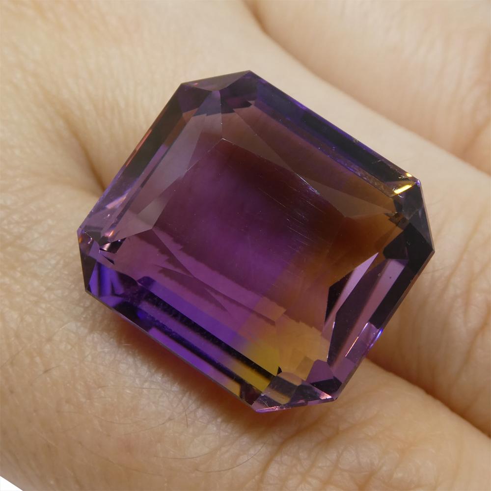 Description:

Gem Type: Ametrine
Number of Stones: 1
Weight: 29.65 cts
Measurements: 19.50x17.50x10.50 mm
Shape: Emerald Cut
Cutting Style Crown: Modified Brilliant
Cutting Style Pavilion: Step Cut
Transparency: Transparent
Clarity: Very Slightly