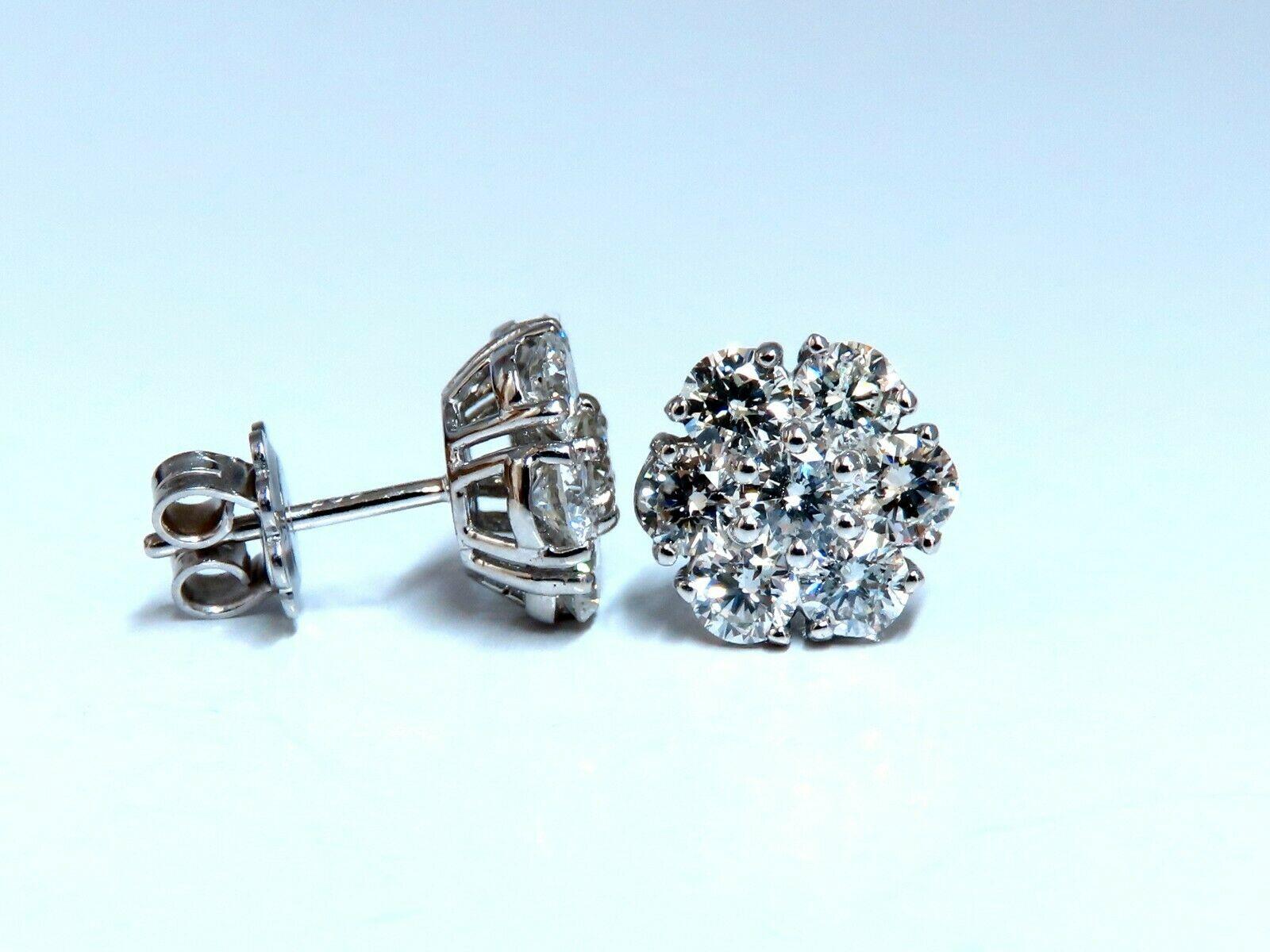 Cluster & Halo Stud Earrings.

2.96cts of natural round diamonds: 

G-color, Vs-2 Si-1 clarity.

14kt. white gold

3.8 grams.

Earrings measure: 11mm Diameter

Comfortable Butterfly

$14,000 Appraisal Certificate to accompany