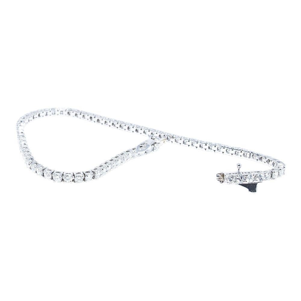 14k white gold bracelet containing 2.97 carats of prong set diamonds. The color and clarity grades of the diamonds contained within the bracelet are E-F, VS1-SI1, respectively. The average polish, symmetry, and cut grade for each of these diamonds