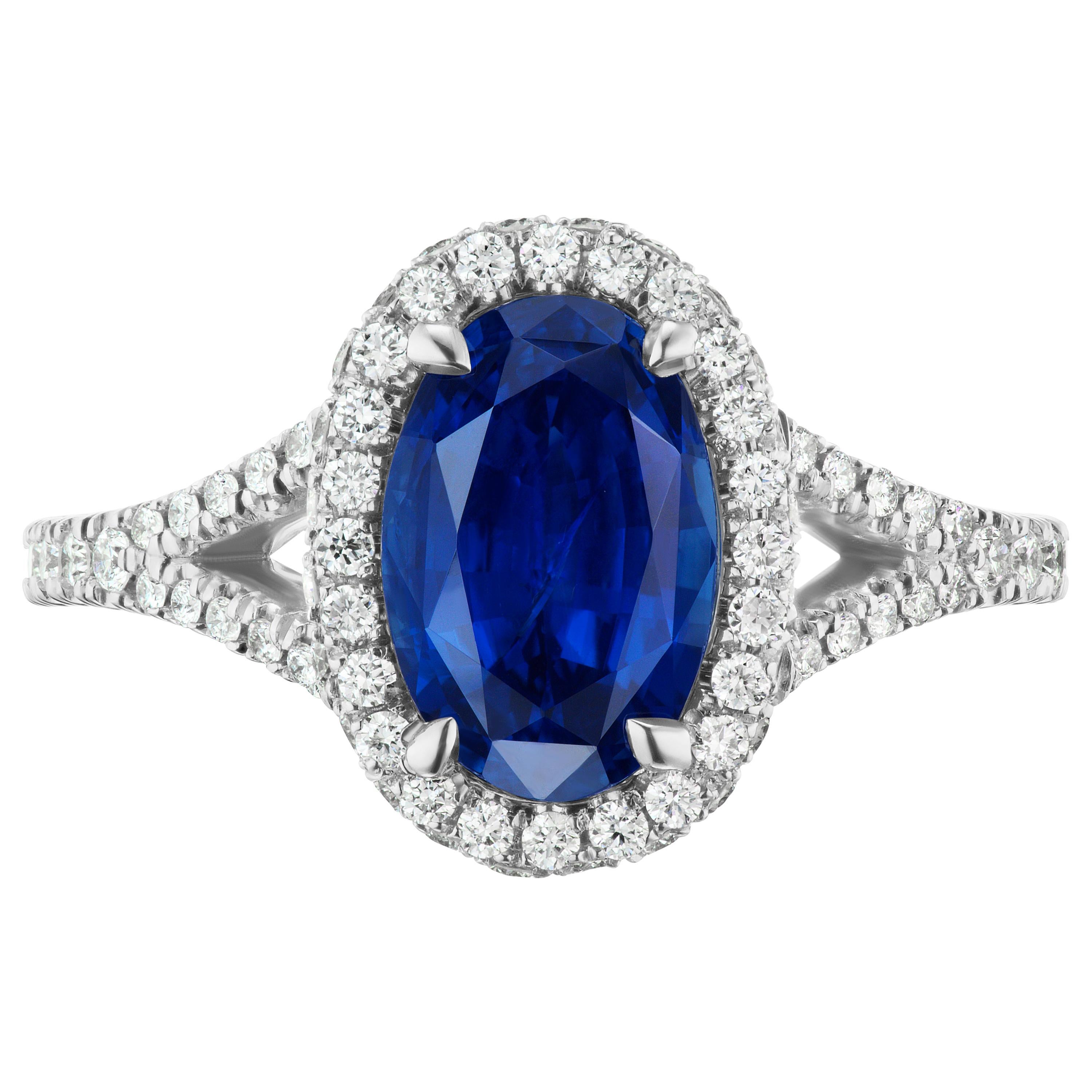 2.97 Carat Conflict Free Oval Blue Sapphire and Diamond 14 Karat Halo For Sale