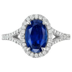 Used 2.97 Carat Conflict Free Oval Blue Sapphire and Diamond 14 Karat Halo