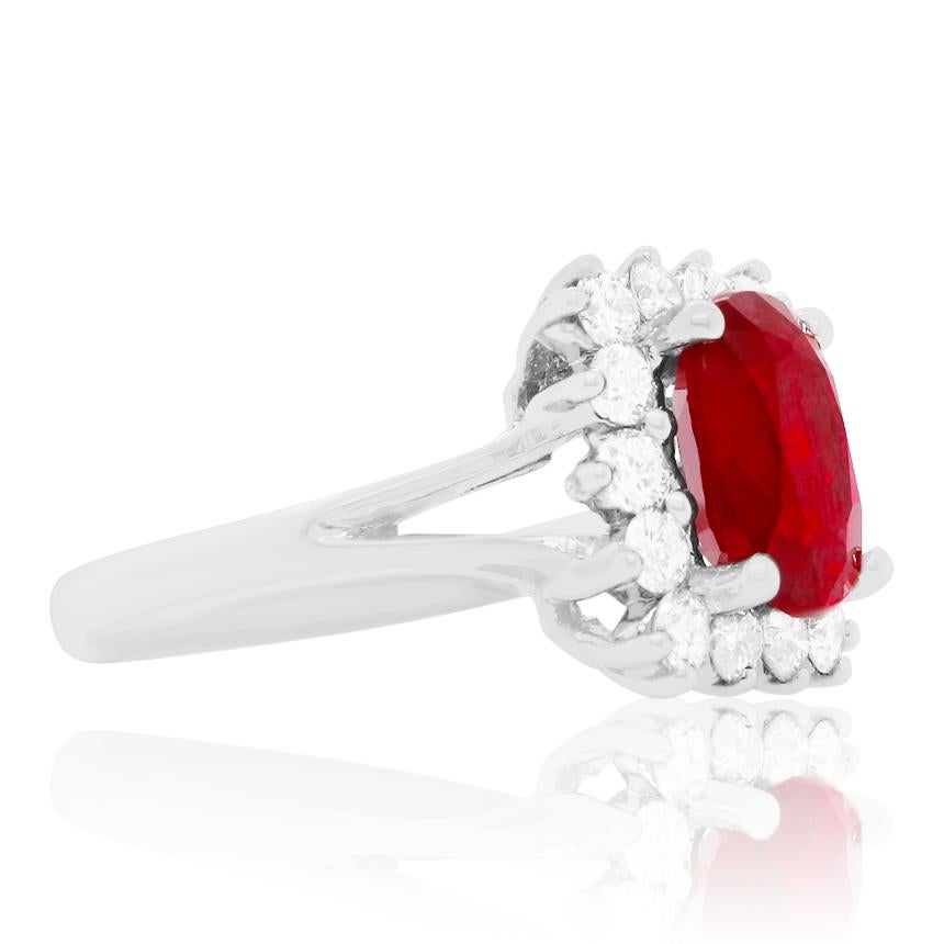 Material: 18K White Gold
Gemstone Details: 1 Cushion Ruby at 2.97 Carats- Measuring 9.9 x 7.2 mm 
Diamond Details: 14 Brilliant Round White Diamonds at 0.82 Carats. SI Clarity / H-I Color. 
Ring Size: 6. Alberto offers complimentary sizing on all