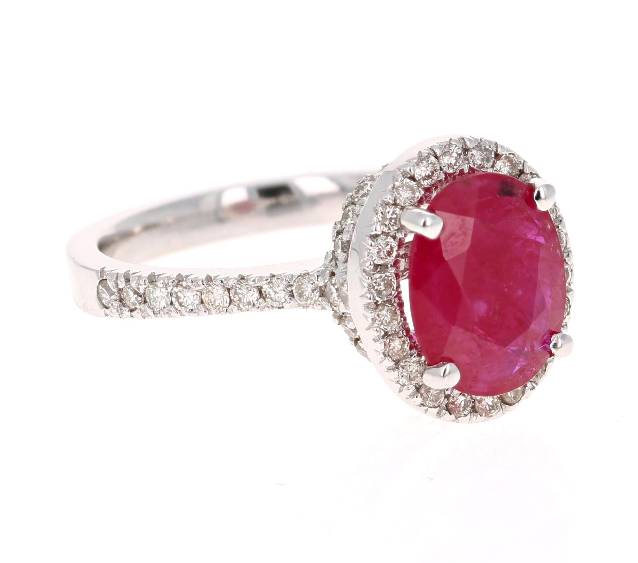 Stunning Ruby Diamond Ring with a 2.34 Carat Oval Cut Ruby and 60 Round Cut Diamonds that weigh 0.63 carats. The total carat weight of the ring is 2.97 carats.

The ring is casted in 14K White Gold and weighs approximately 5.1 grams. 

It is a size