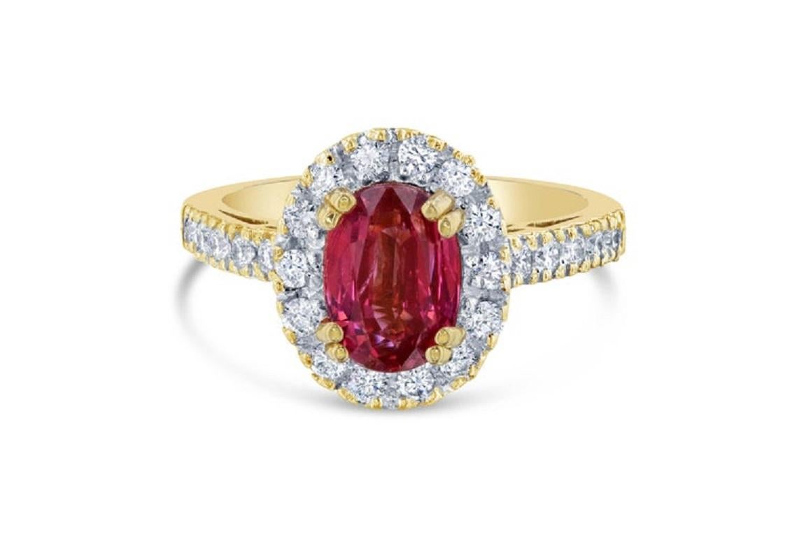 The Spinel is natural and weighs 2.37 Carats and is surrounded by 25 Round Cut Diamonds at 0.60 Carats. The clarity and color of the diamonds are VS2-F. The Total Carat Weight of the ring is 2.97 Carats. 

It is set in 18K Yellow Gold and is 6.1