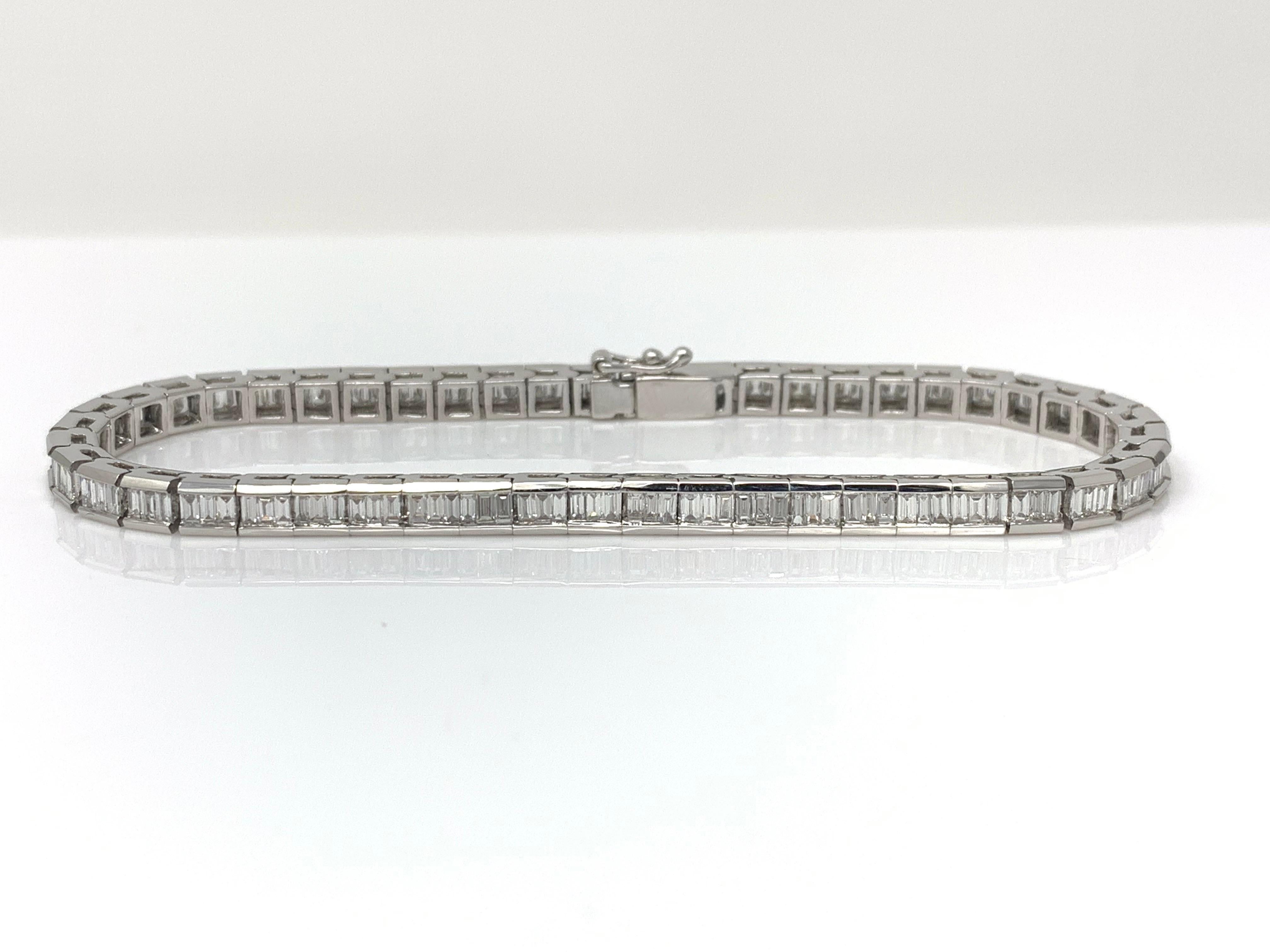 This gorgeous white baguette diamond bracelet is hand crafted in 18k white gold. The diamond weight is 2.97 carat with G-H color and VS clarity. The gold weight is 17.600 grams. The length of the bracelet is 7 1/2 inches.