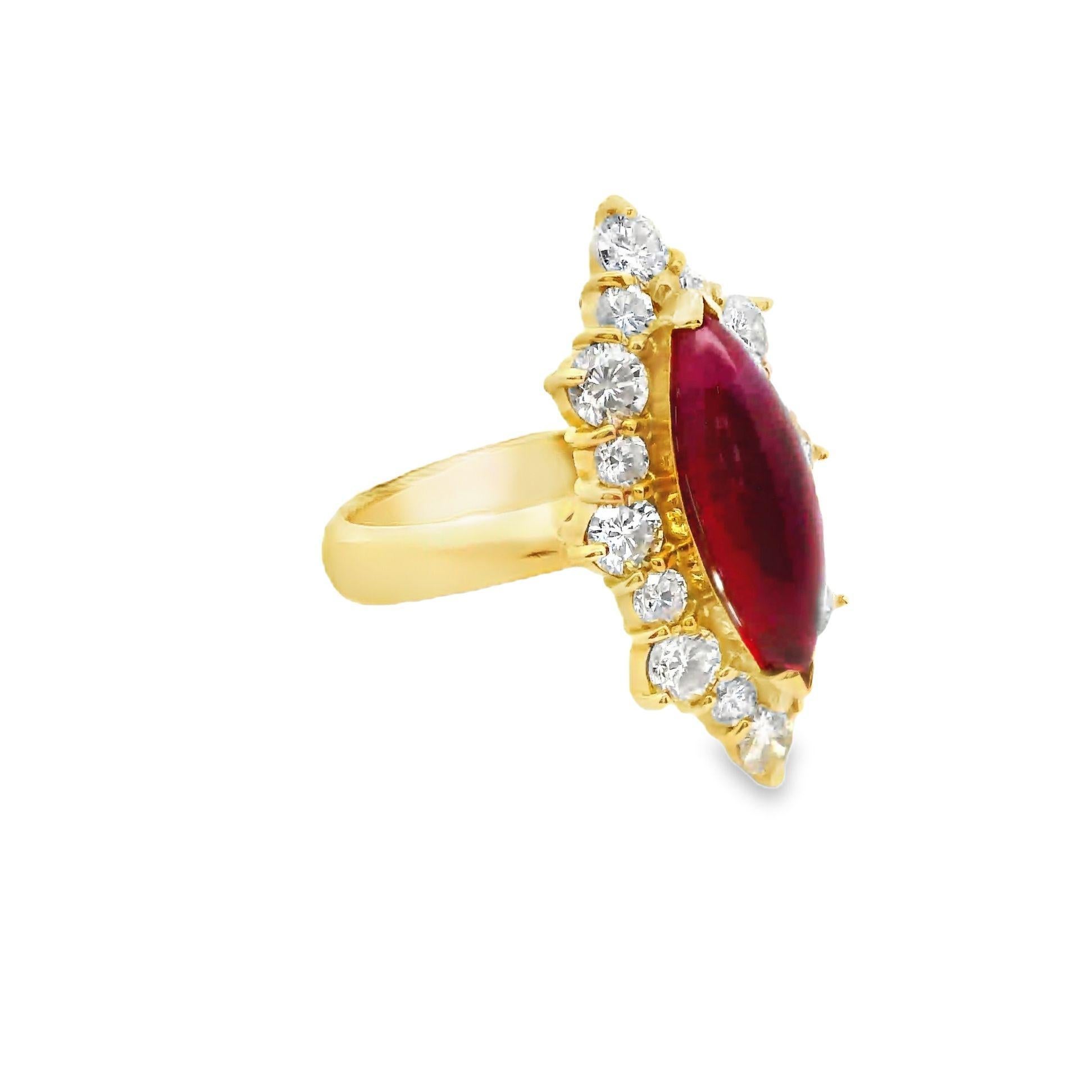 A striking 2.98 carat ruby takes center stage in this contemporary designed ring. The ruby, cut in a smooth cabochon-marquise style, displays a deep red hue which is seen in fine Burmese rubies such as this. Surrounding the ruby are 1.41 carats of