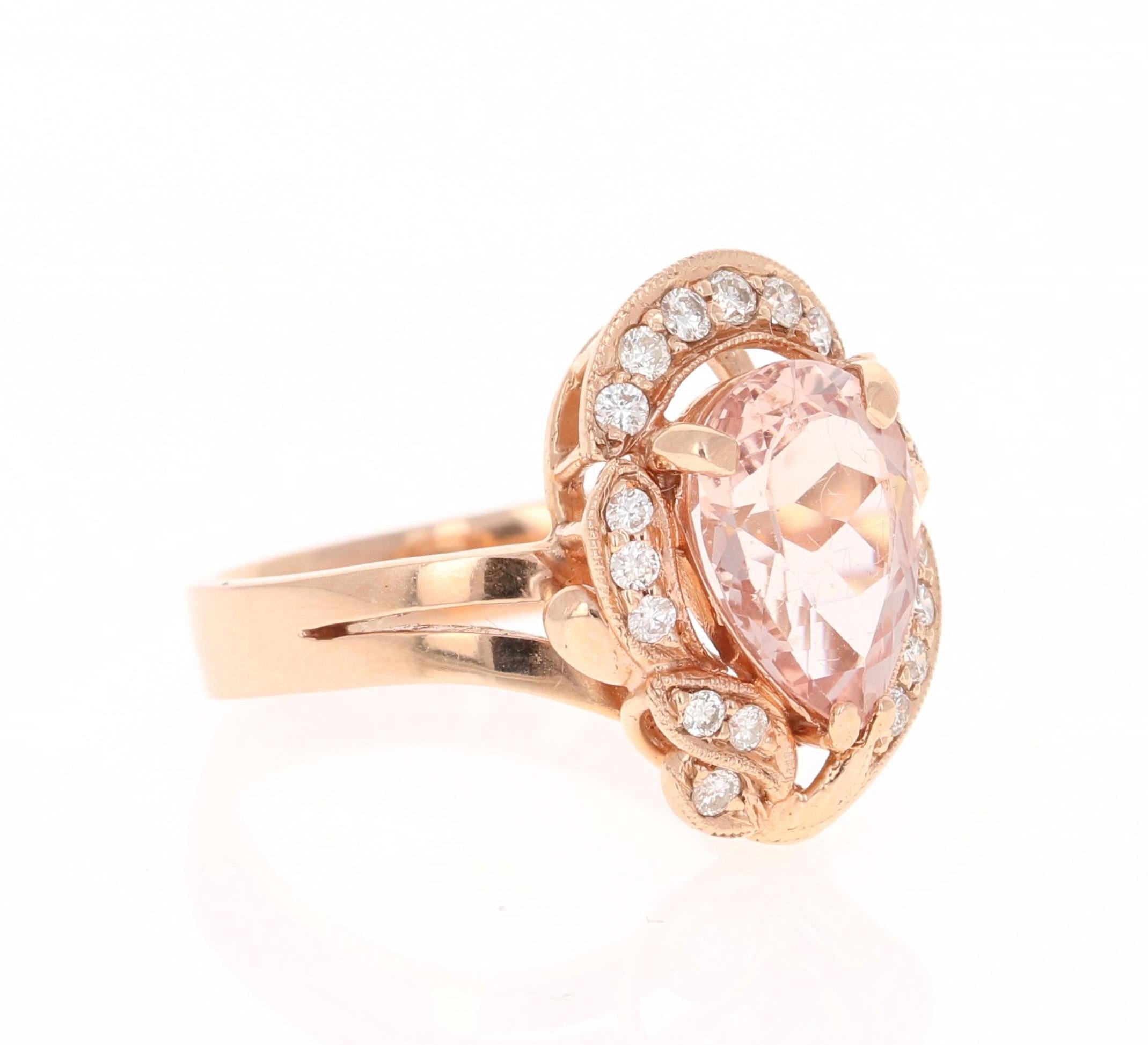 This Morganite ring has a 2.64 Carat Pear Cut Morganite and is surrounded by 18 Round Cut Diamonds that weigh 0.34 Carats. The total carat weight of the ring is 2.98 Carats.  

The Morganite is 13 mm x 9 mm and the face of the ring is 18 mm x 14 mm.