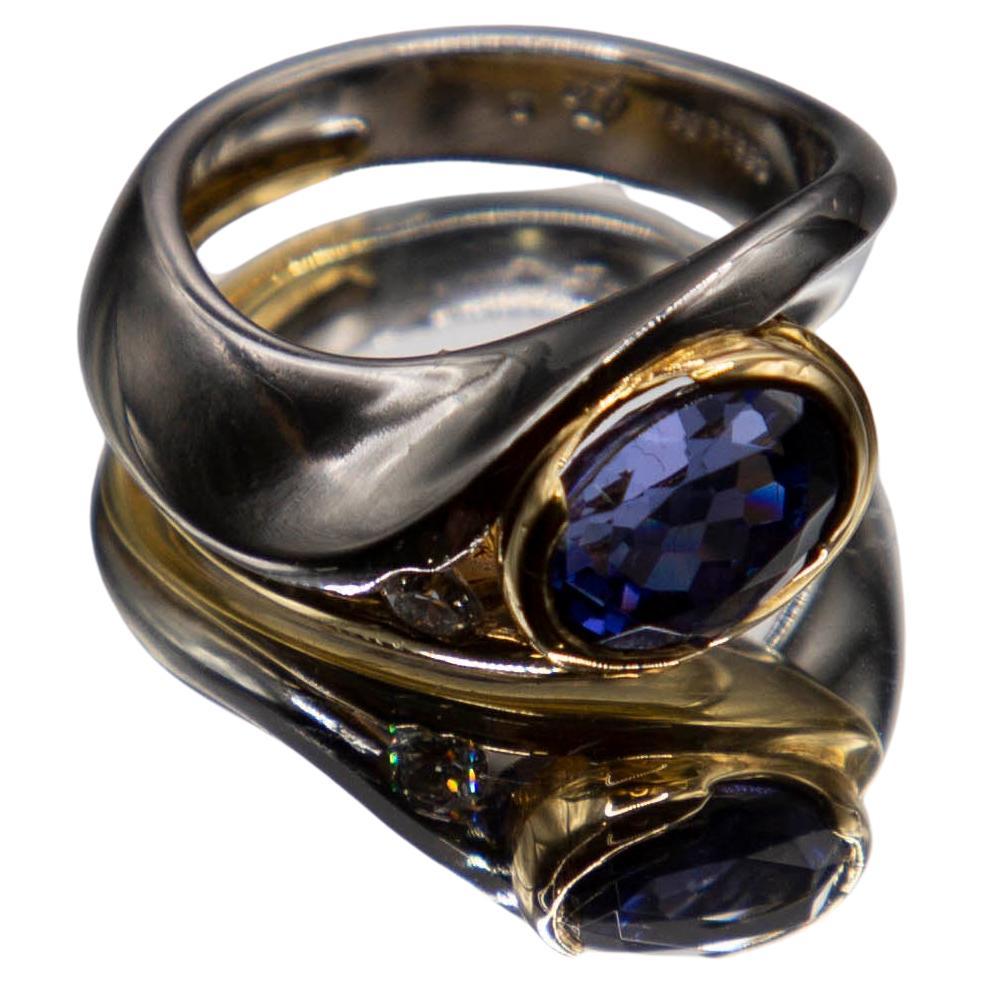 2.98 carat oval tanzanite in Platinum/18k yellow gold with 0.15ct. fine diamond For Sale