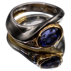 2.98 carat oval tanzanite in Platinum/18k yellow gold with 0.15ct. fine diamond